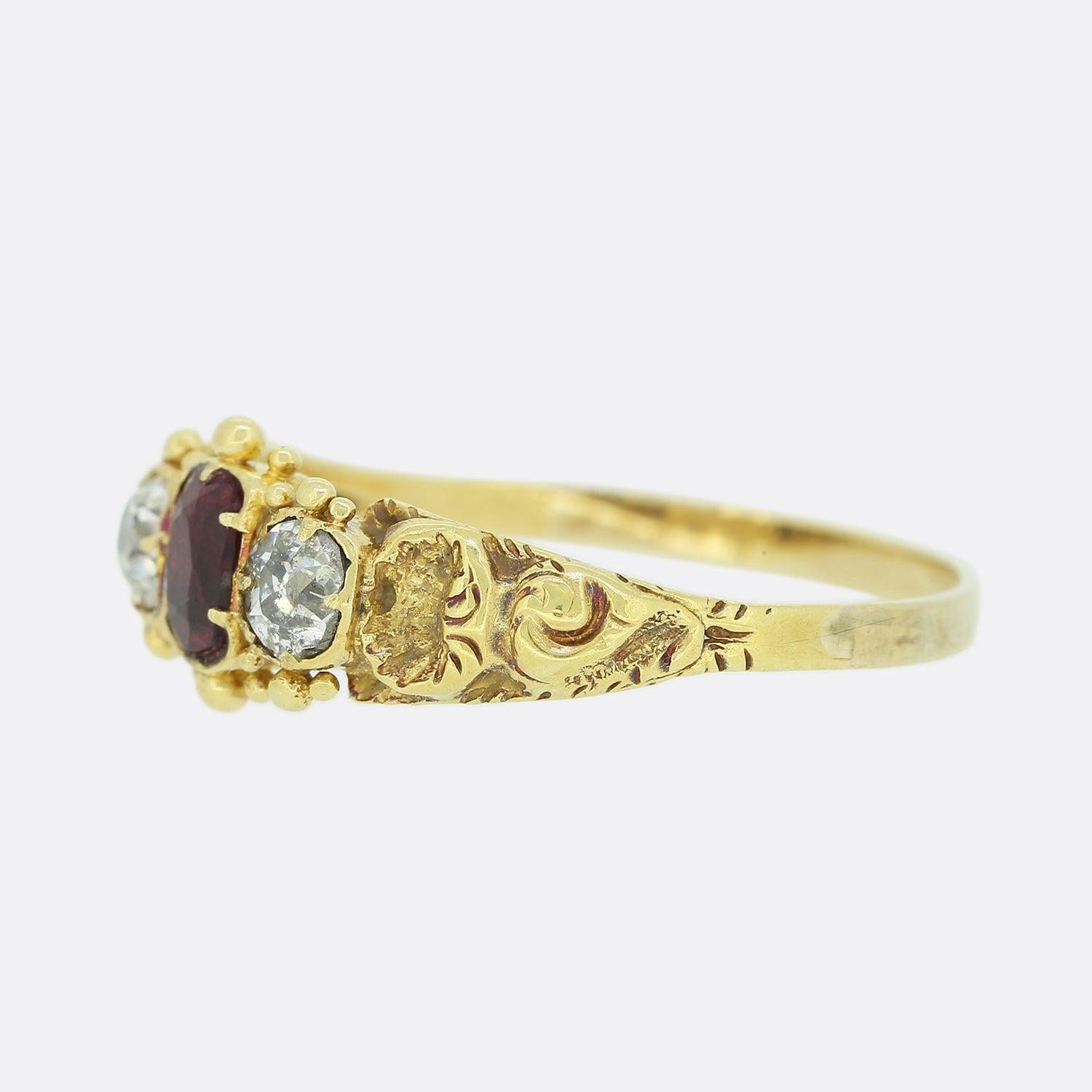 This is a wonderful 15ct yellow gold Georgian ring. The ring features a central rich red ruby with a bright white old cut diamond on each shoulder. The gemstones sit in closed back settings in a typical Georgian style and the ring features wonderful