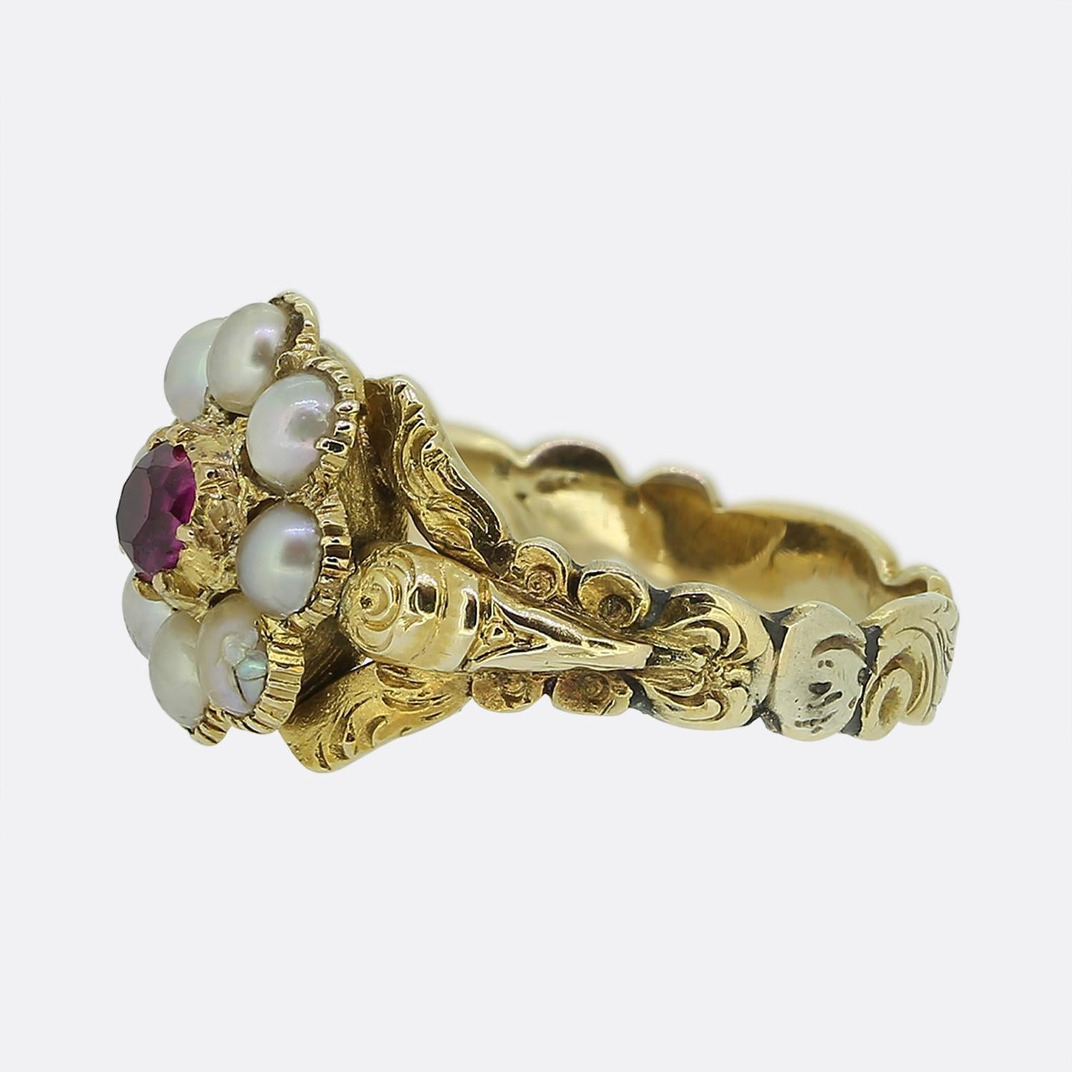 Here we have a fabulous cluster ring originally dating back to the Georgian period. A single round faceted ruby sits slightly risen at the centre of the face and is circulated by an array of round shaped perfectly matched natural pearls. However,