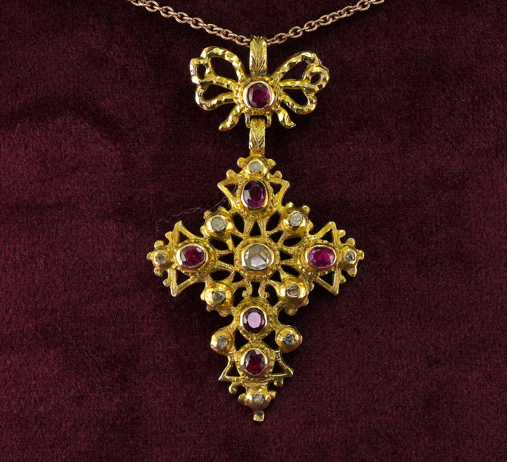 This rare Georgian period cross pendant is 1770 ca
22 Kt solid gold, superb design artful made throughout, adorned with red pigeon blood natural Rubies, our estimate is 1.50 Ct and rose cut Diamonds, one larger in the middle and little accent