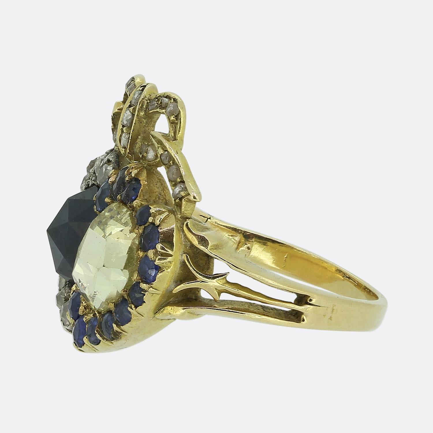Here we have a delightful example of a Victorian double heart ring. In this case, a chunky rose cut sapphire possessing a mid navy blue colour tone sits aside a natural diamond of the same cut at the centre of the face. These focal stones are