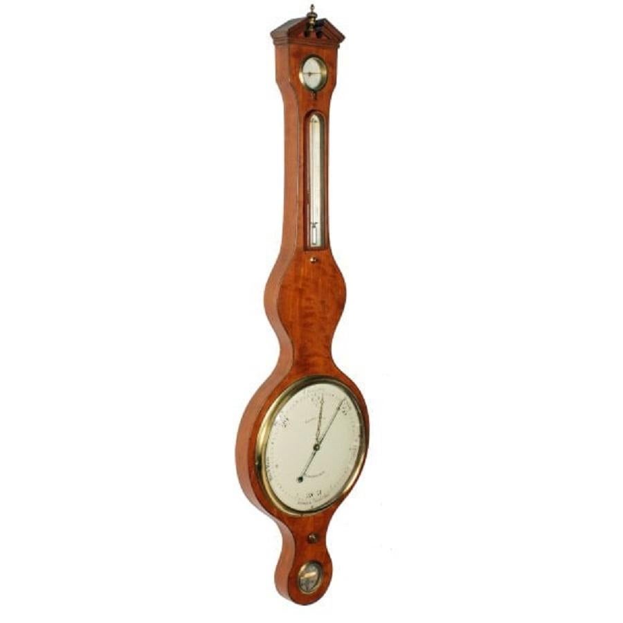 A late 18th to early 19th century Georgian satinwood veneered wheel barometer and thermometer.

The barometer has an unusual 10