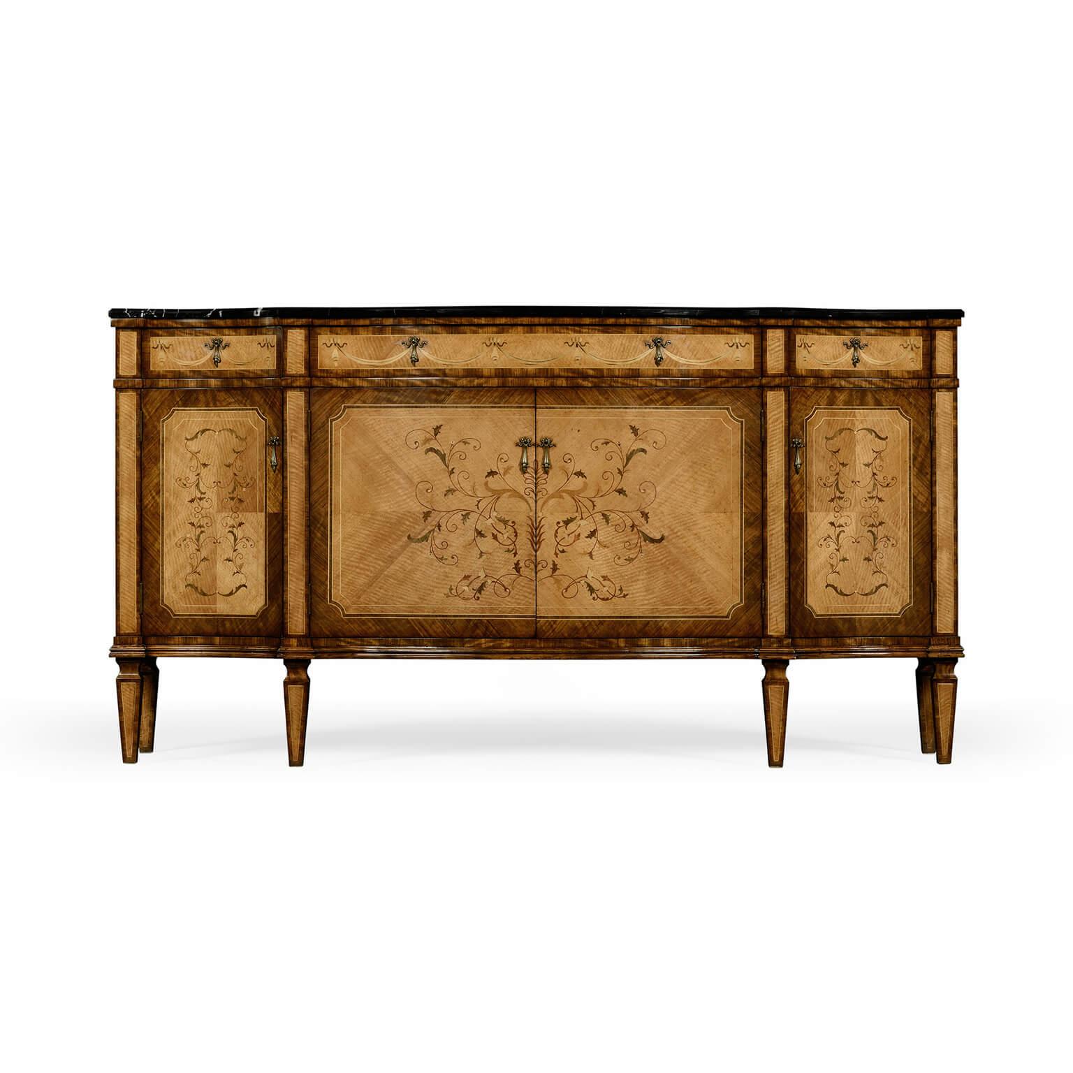 Striking satinwood veneered serpentine bowfront sideboard with black marble top, the four doors and three drawers with fine contrasting floral inlays and swagged brass handles. Raised on tapering block feet with contrasting stringing.

Dimensions: