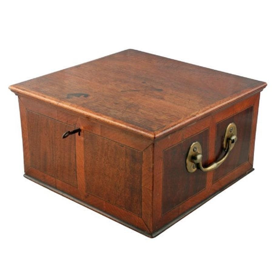 An 18th century Georgian mahogany box.


The box has a hinged lid that is decorated with satinwood cross banding, the sides have a pair of mahogany panels that have box wood and ebony line inlay to the inner edge and satinwood cross