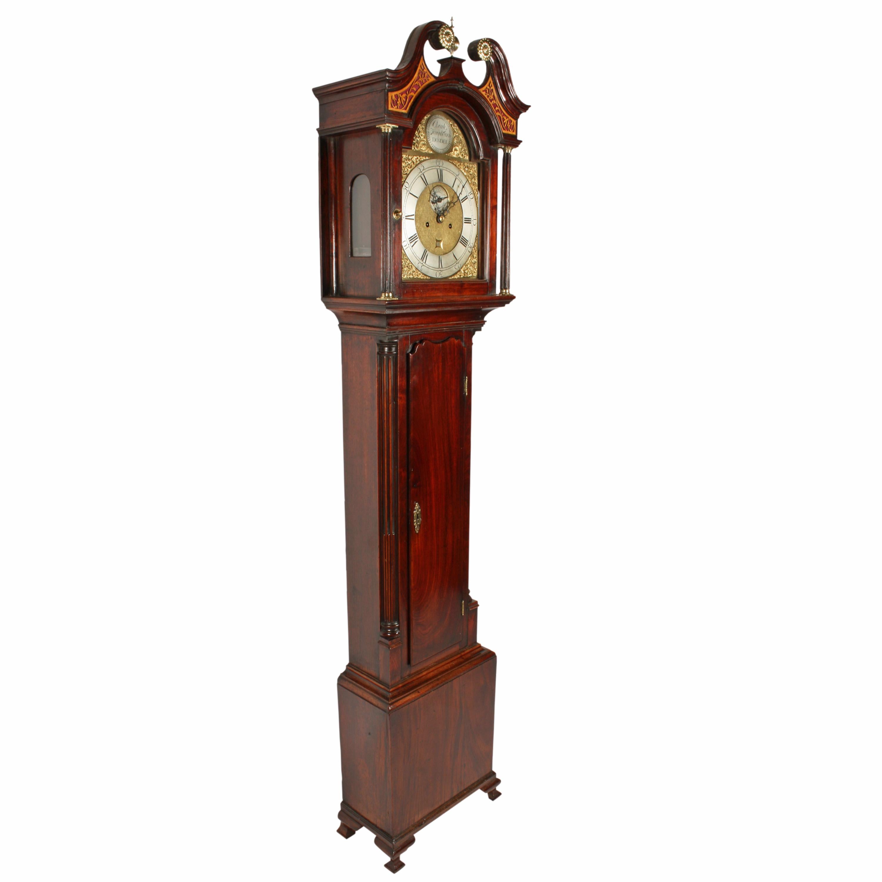 An 18th century Georgian Scottish mahogany brass dial grandfather clock.

The clock has an eight day striking movement with a brass dial that has a silverised chapter ring and a seconds dial.

The top of the dial has a silverised maker's name
