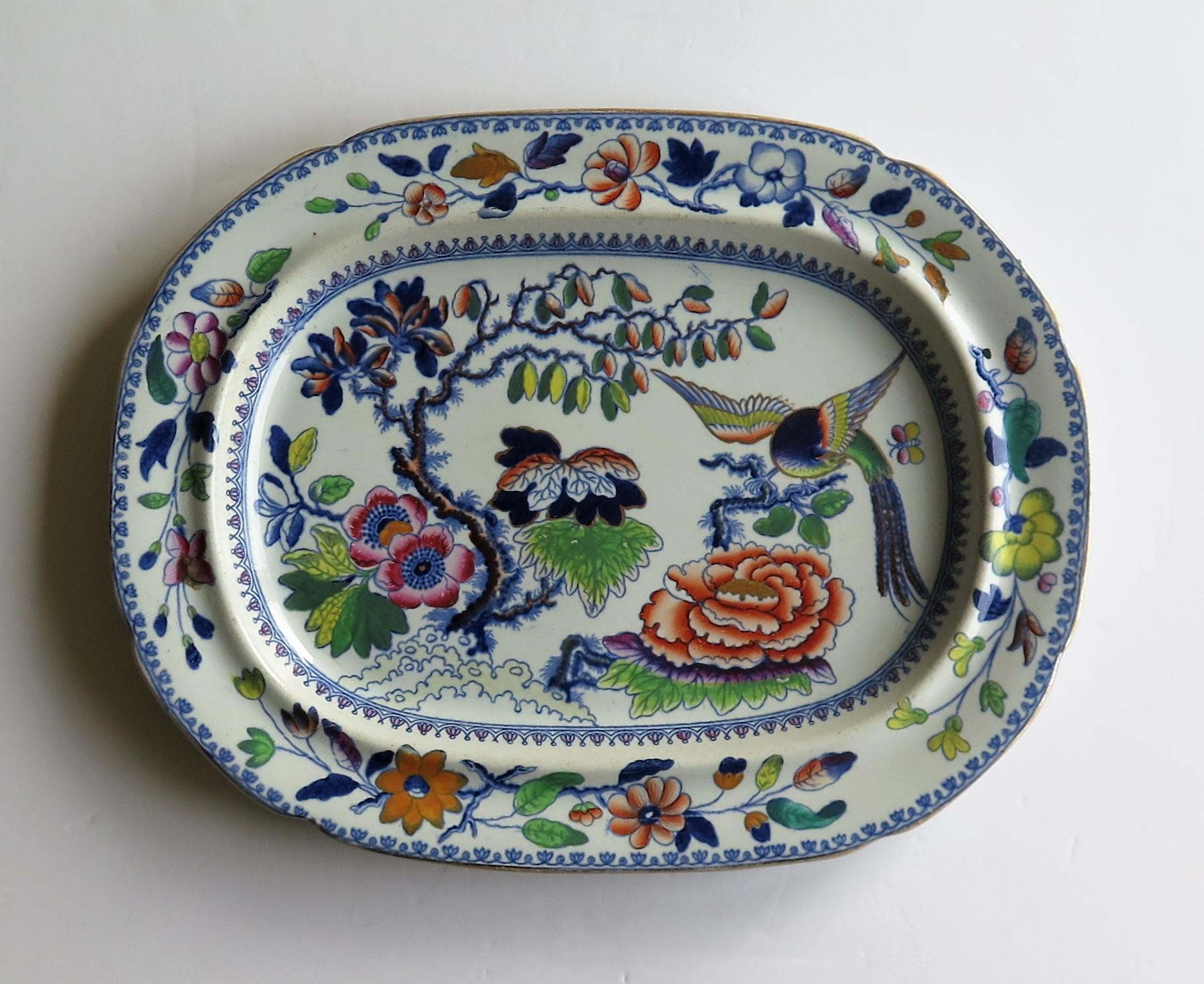 This is a good rounded rectangular Ironstone (stone china) serving platter or plate, in the flying bird pattern, circa 1825, which we attribute to the factory of Hicks, Meigh and Johnson of Shelton, Staffordshire Potteries, England, who made good