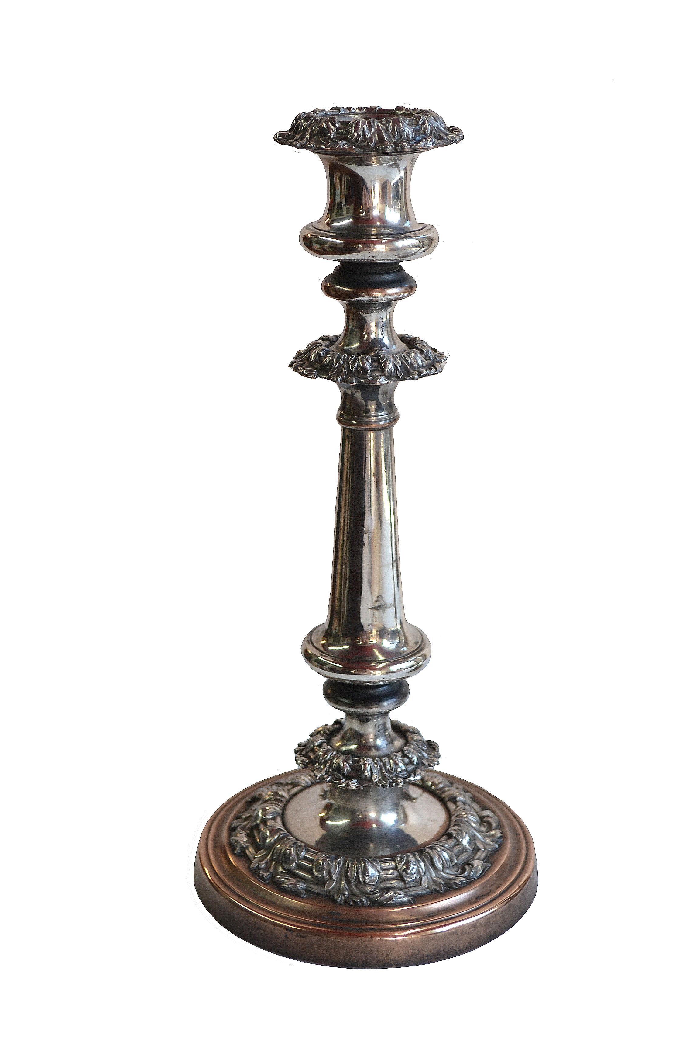 19th Century Georgian, Sheffield Silver Plate Candlesticks, Pair

Pair of English, Georgian, George IV Sheffield silver plate candlesticks. Vintage, distressed silver finish. Silver loss to base. Minor loss to other areas. Hollow ware, circa 1820.