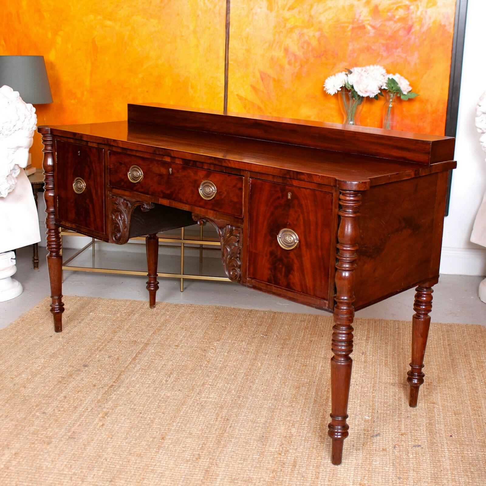 A fine quality rare form George IV period Cuban mahogany sideboard.
The polished flamed Cuban mahogany inlays boasting an impressive grain.
The platform step to the rectangular top having rounded corners supported on ring-turned column legs, the