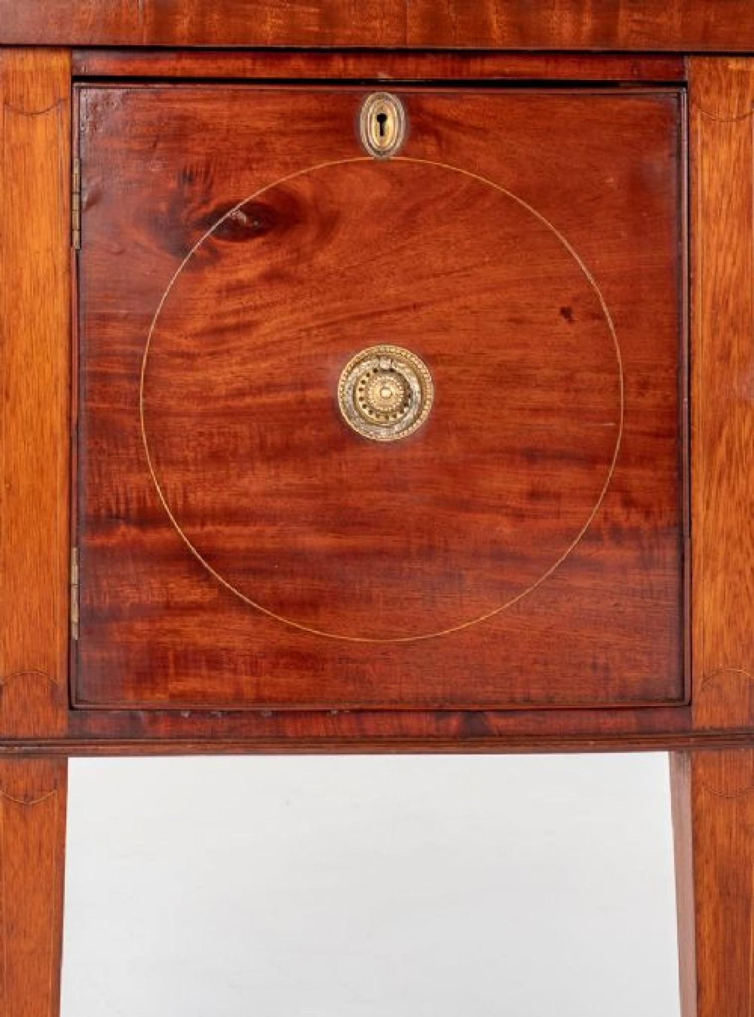This bow front sideboard is raised upon tapered legs with spade feet.
Having an arrangement of 2 oak lined drawers and 1 cupboard.
The drawers and cupboard having boxwood line inlays and retain their original cast ring pull handles.
circa 1880