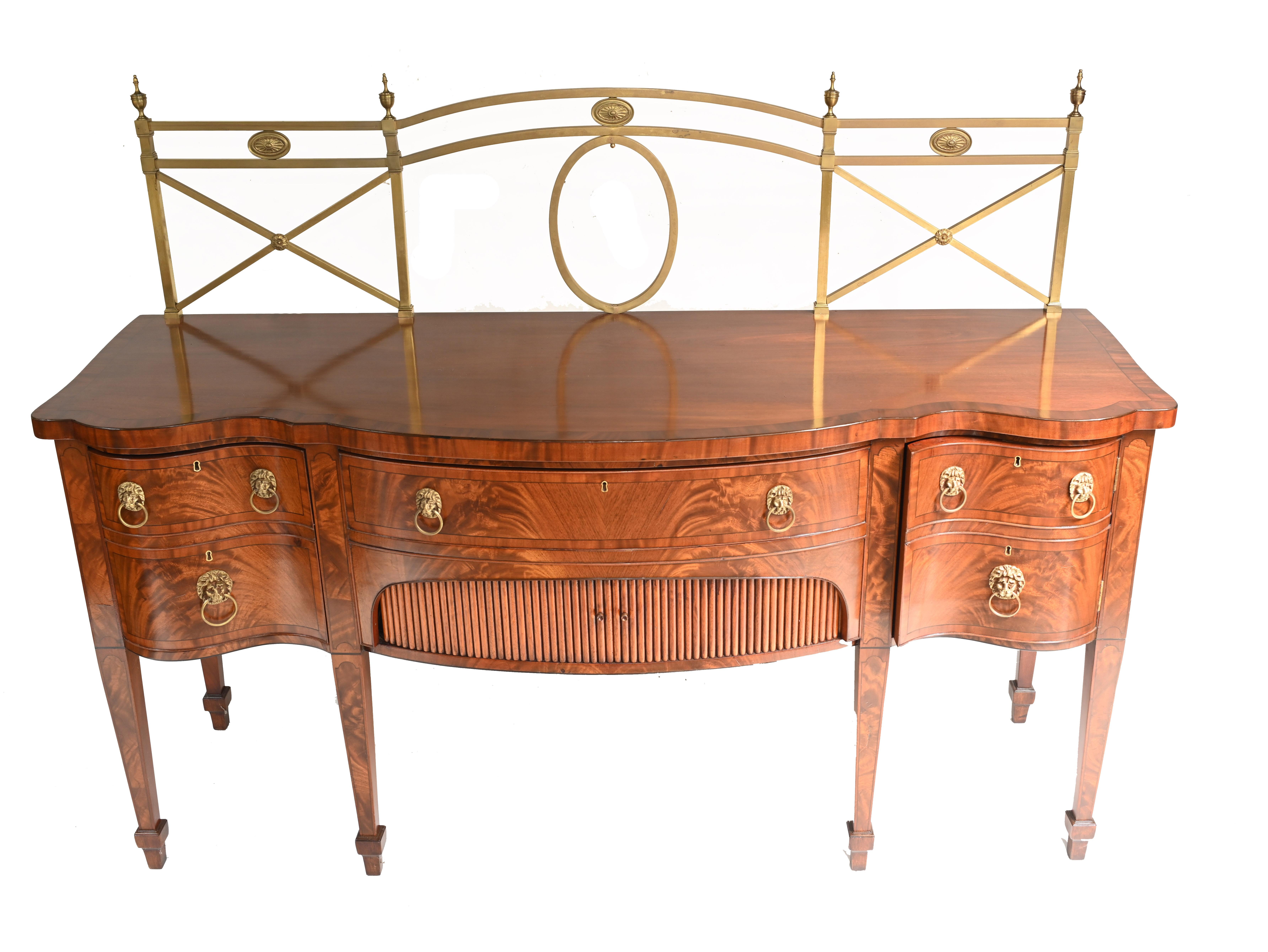Classy Georgian sideboard in mahogany
Features the original brass gallery
Classic lions head handles 
Big piece with lots of storage space and drawers
We date this piece to circa 1880
Some of our items are in storage so please check ahead of a