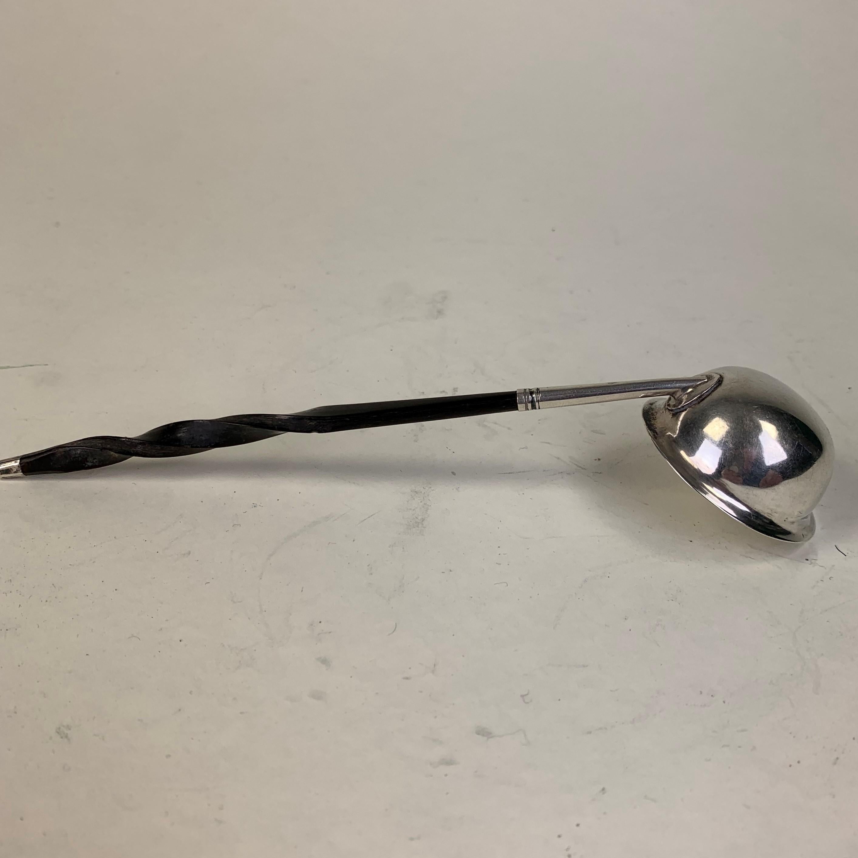 Georgian silver Brandy or Toddy ladle with twisted whalebone handle, in good condition.
Slightly worn hallmarks to the bowl, made by JS/Joshua Snatt, 1801, London.
Measures: 18 cms long 12 grams. Bowl is 14.25 mm diameter.