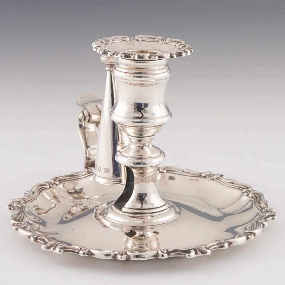 Heading : Sterling silver chamberstick
Date : Hallmarked in Sheffield in 1836 for Creswick and Co
Period : William IV
Origin : Sheffield, England
Decoration : Scrolled leaf detail to the rims of both the sconce and drip tray. Looped handle with