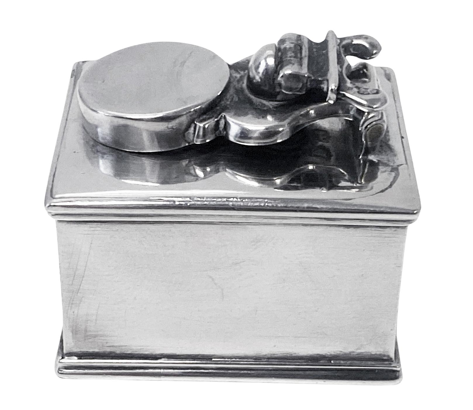 Georgian Silver travelling Inkwell London 1814 prob John Douglas. Small rectangular inkwell plain with moulded borders and a hinged screw-down cover surmounted by a folding shaped and reeded screw. Good heavy gauge silver. Good hallmarks on body,