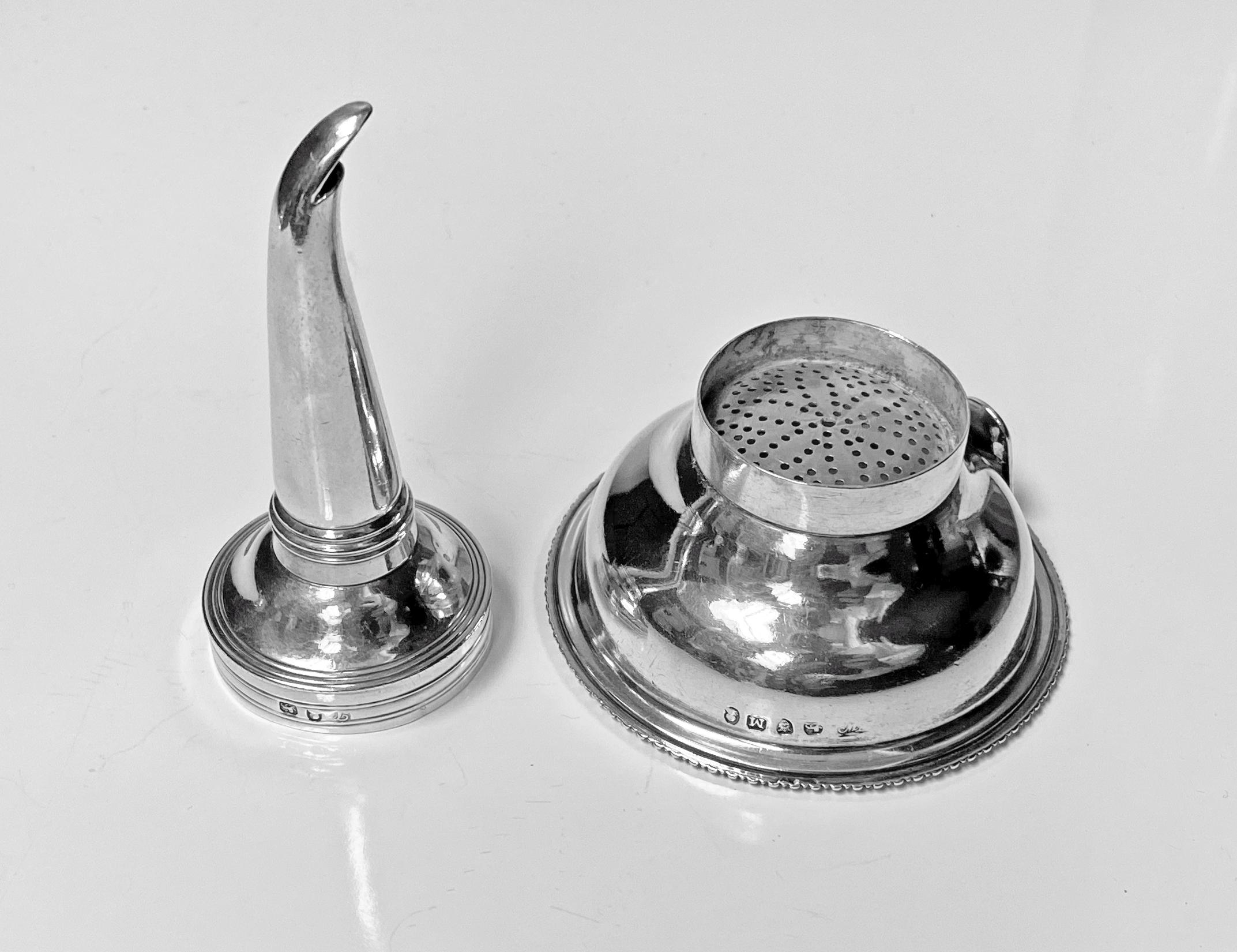 Antique Georgian silver wine funnel, London 1807 Thomas Wallis 11. The funnel of typical form, the base with gadroon surround, plain body and upper reed funnel. Marked on body and strainer. Measures: Height 4.75 inches. Weight 86.28 gm. Condition: