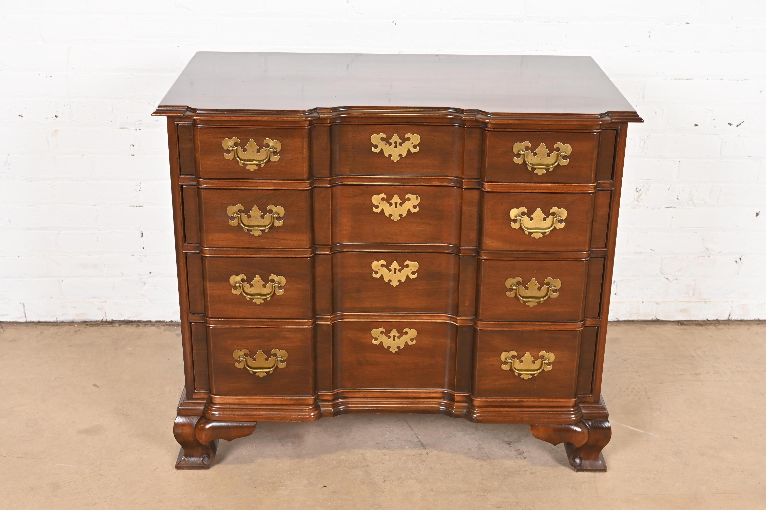A gorgeous Georgian or Chippendale style four-drawer chest of drawers or commode

USA, Circa 1980s

Beautiful carved solid cherry wood, with original brass hardware.

Measures: 36