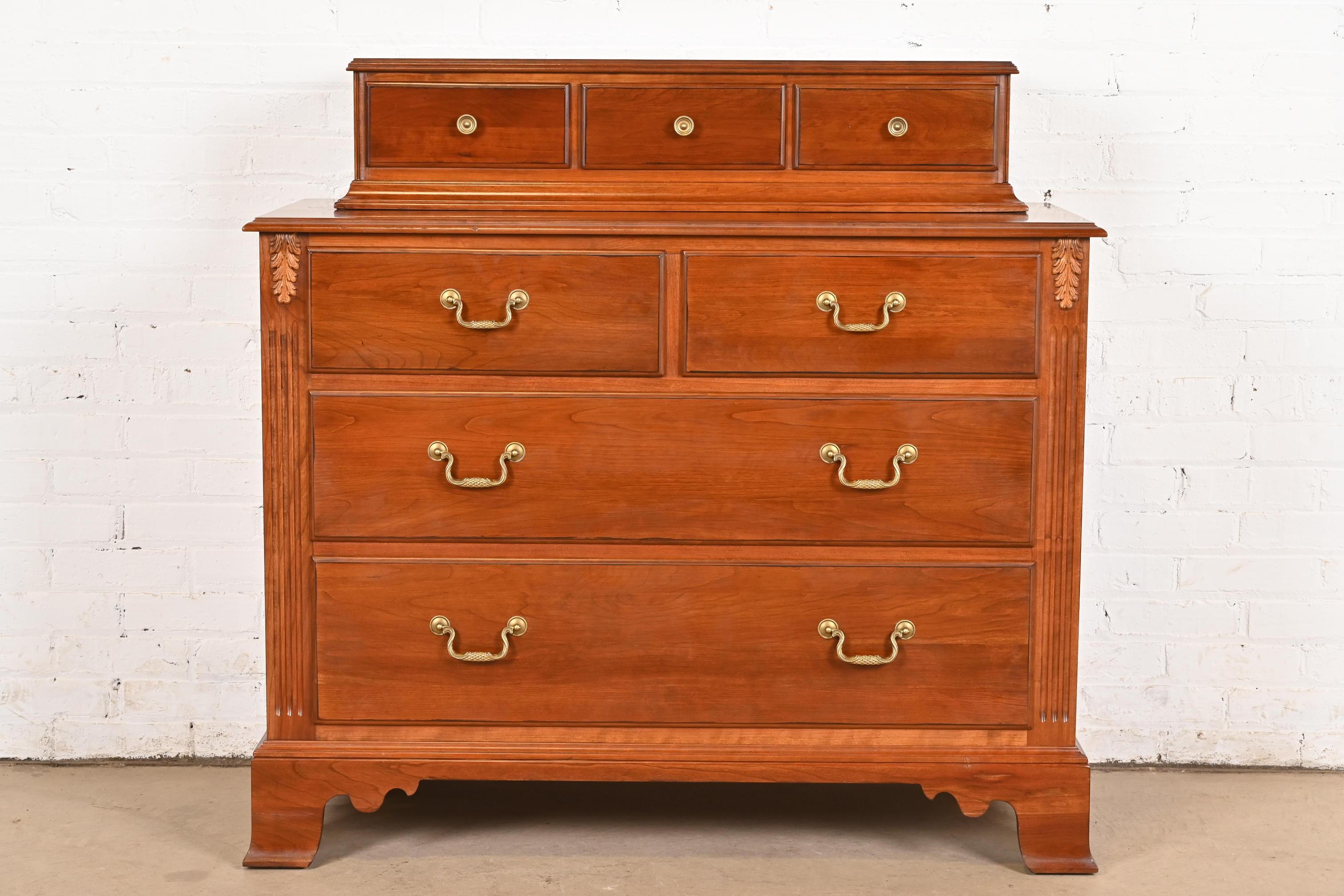 A gorgeous Georgian, Chippendale, or Regency style dresser or chest of drawers

USA, Late 20th Century

Carved solid cherry wood, with original brass hardware.

Measures: 45