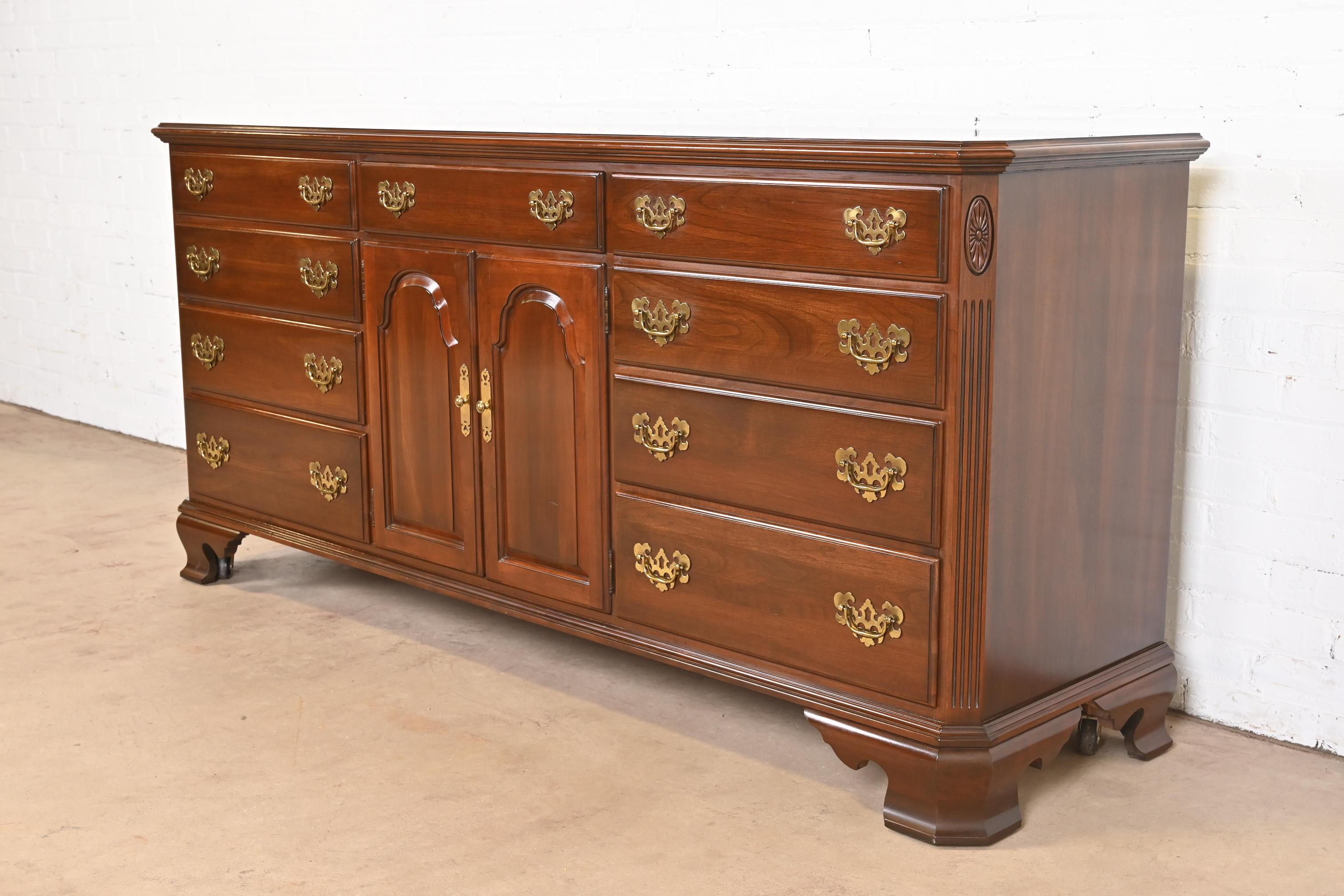 A gorgeous Georgian or Chippendale style eleven-drawer dresser or credenza

USA, 1980s

Carved solid cherry wood, with original brass hardware.

Measures: 74