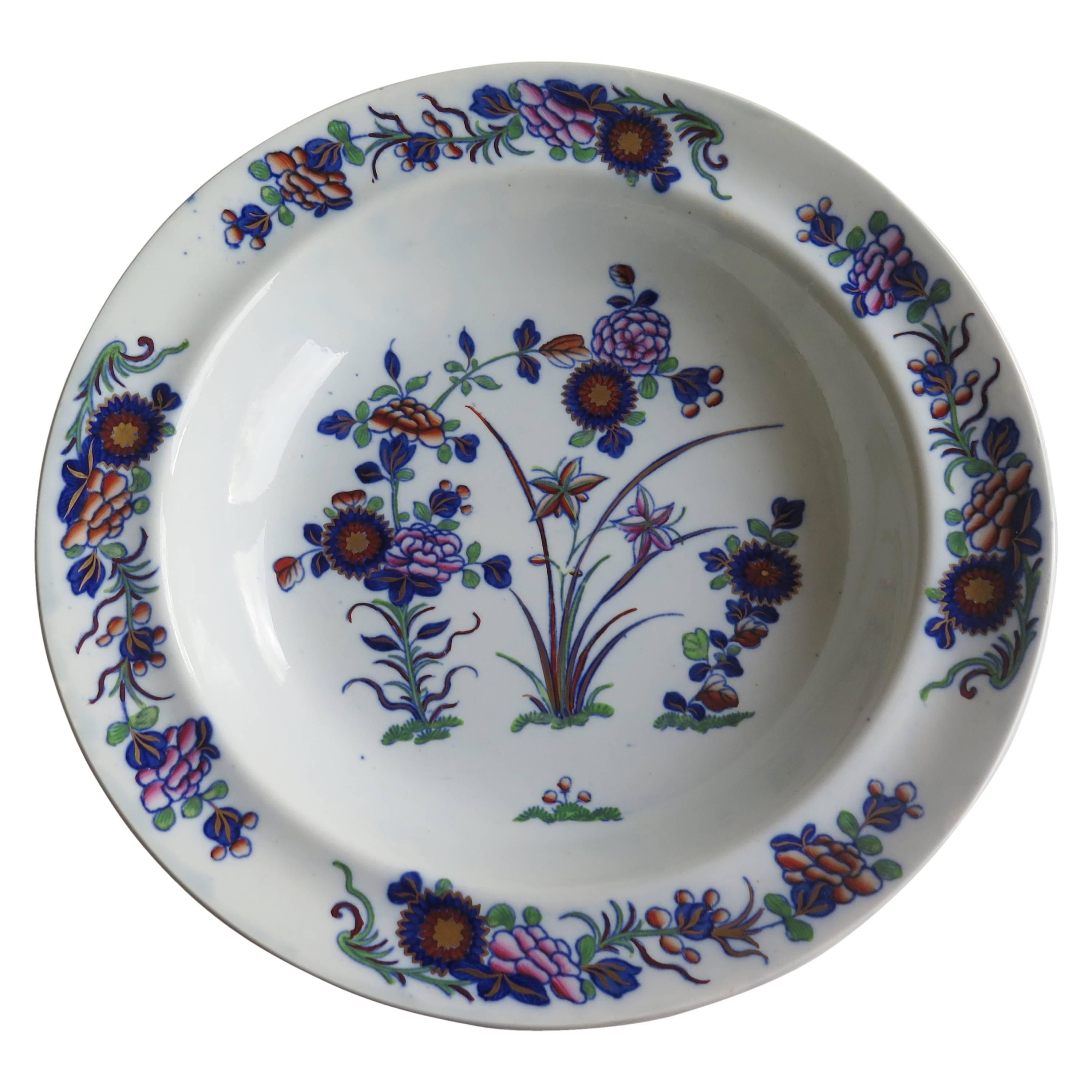 This is a beautiful bowl or deep plate produced by the Spode factory and made of a type of a pottery called Pearl-ware, in the early 19th Century.

The pattern is called 