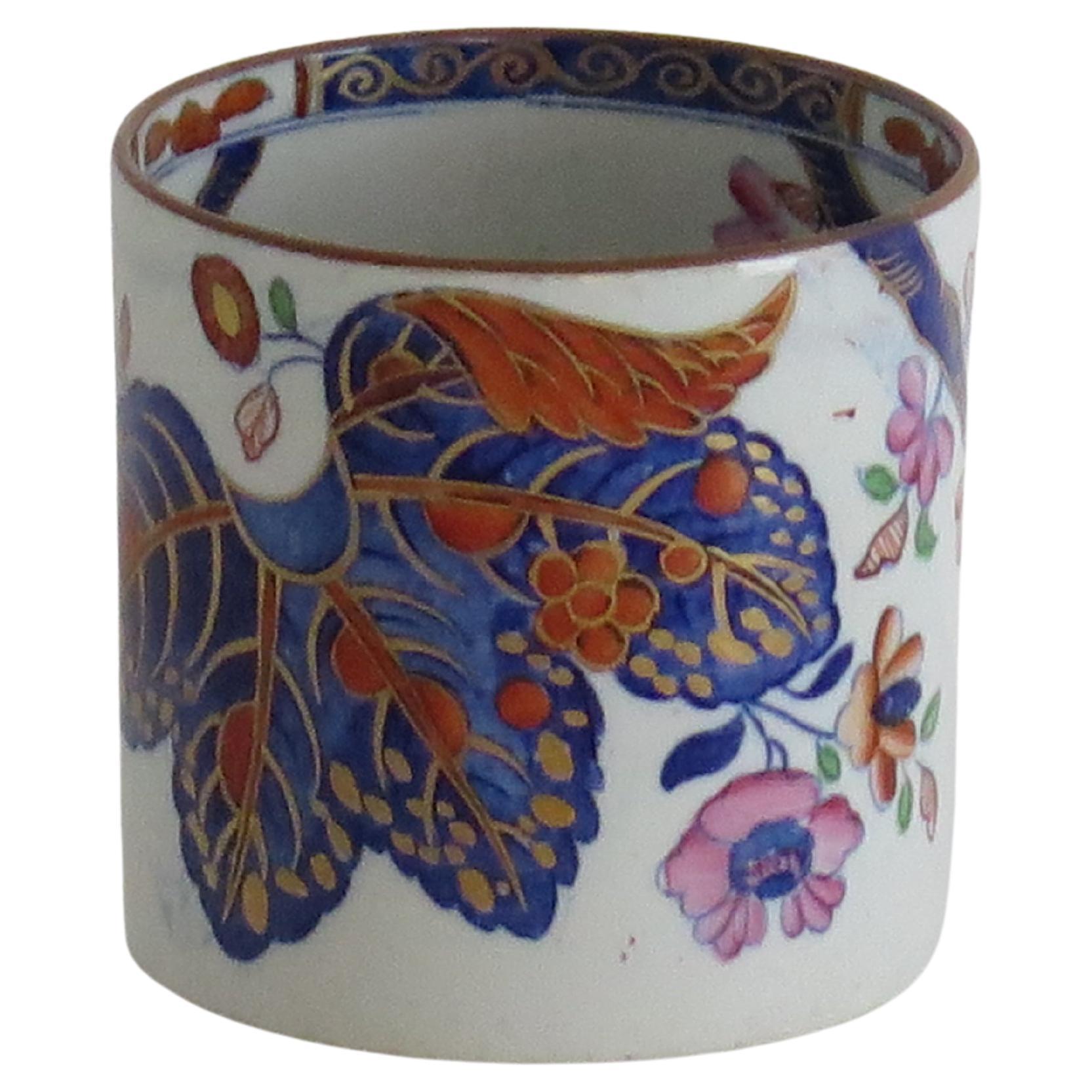 This is a very good stone China (Ironstone) coffee can hand painted in the tobacco leaf pattern, number 2061, made by the Spode factory in the early 19th century, English Georgian period, circa 1820.

This coffee can or cup made from Ironstone China
