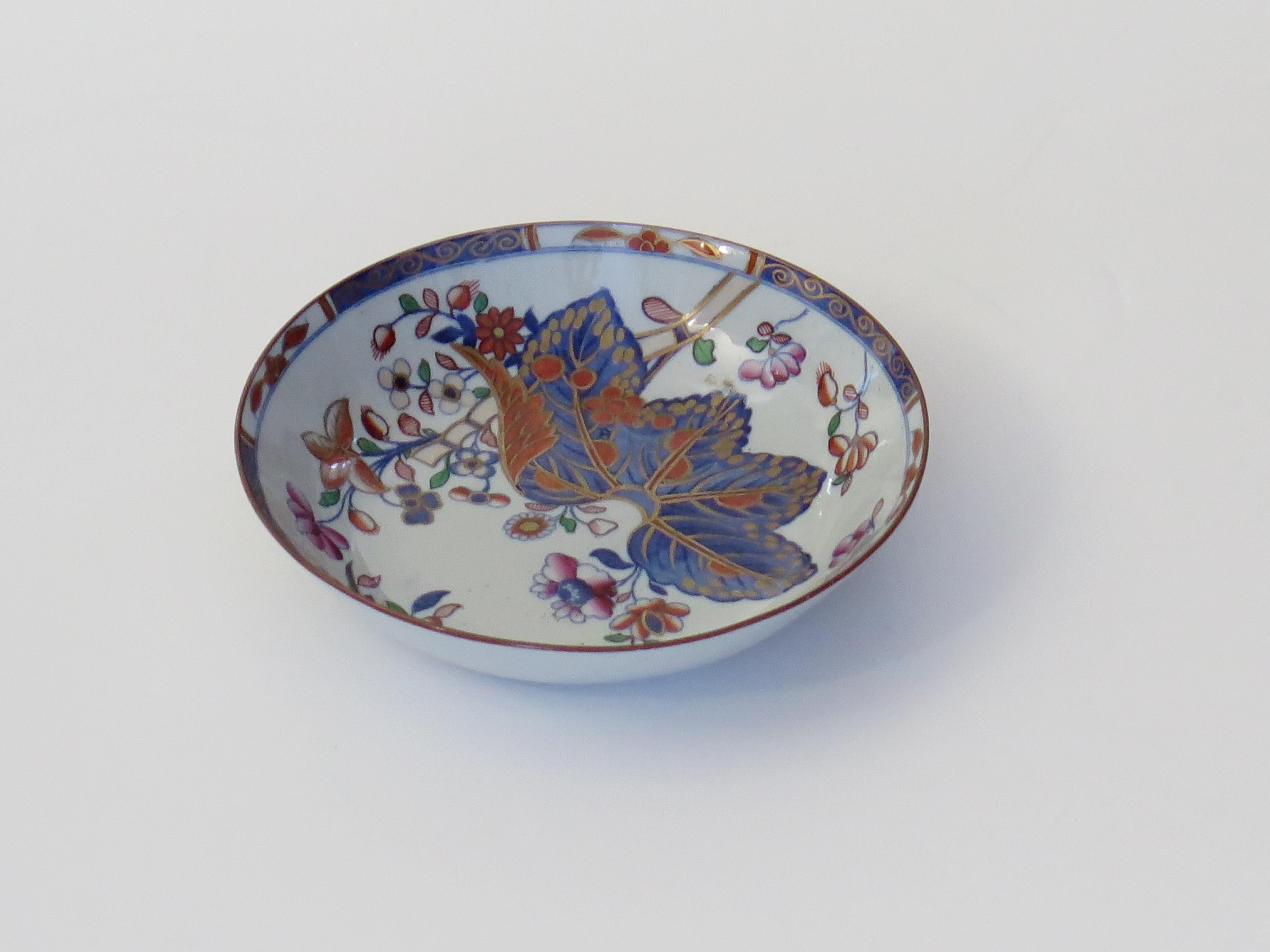 This is a very good stone China (Ironstone pottery) Dish or small bowl, hand painted in the tobacco leaf pattern, number 2061, made by the Spode factory in the early 19th century, English Georgian period, circa 1820.

The dish is made from Ironstone