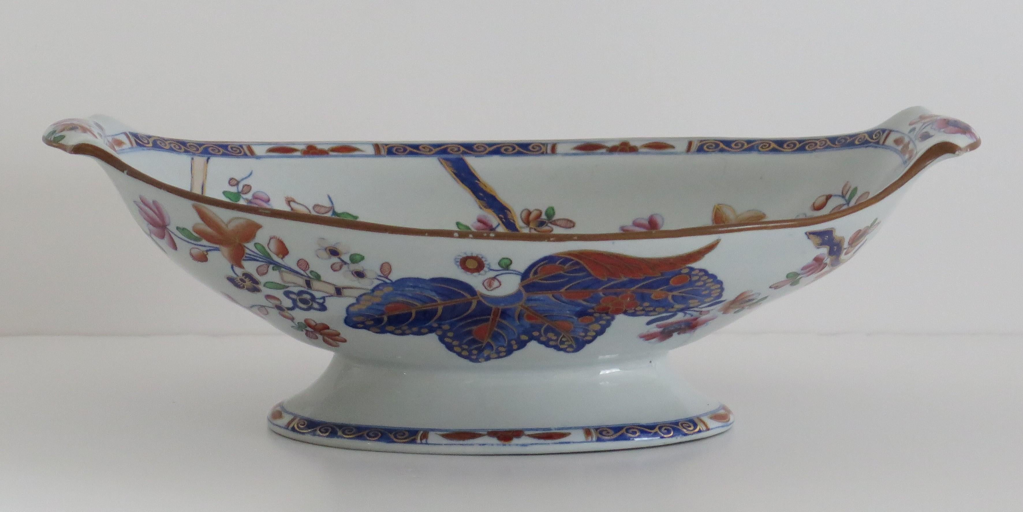 This is a very good Stone China (Ironstone) large Pedastal Bowl, hand painted in the tobacco leaf pattern, number 2061, made by the Spode factory in the early 19th century, English Georgian period, circa 1820.

The bowl is raised on an oval foot