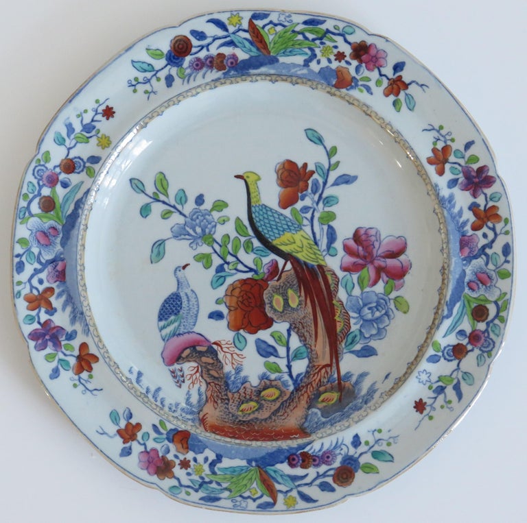This is a very decorative side plate by Spode, made of Stone China (Ironstone) decorated in the Oriental Pheasant pattern, dating to the Georgian period of circa 1820.

The plate is circular in shape with a notched rim and is decorated in one of