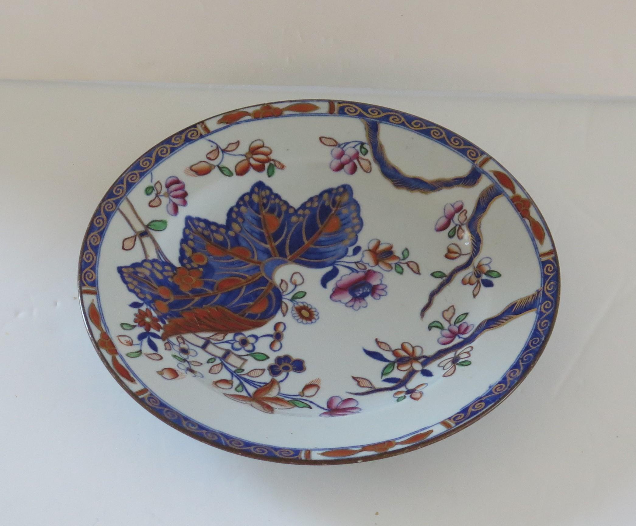 This is a very good stone China (Ironstone) side plate, hand painted in the tobacco leaf pattern, number 2061, made by the Spode factory in the early 19th century, English Georgian period, circa 1820.

The plate is made from Ironstone China and