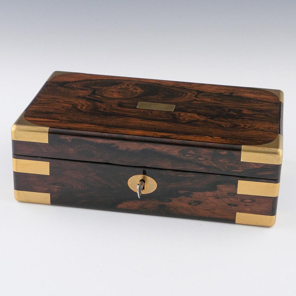 Heading : Georgian stationery box by William Lund

Date : c1840

Period : Vicotira

Origin : England

Decoration : Brass bound box with leather lined inteior. Lift off cover reveals numerous compartments for stationery. “Lund 24 Fleet St London”