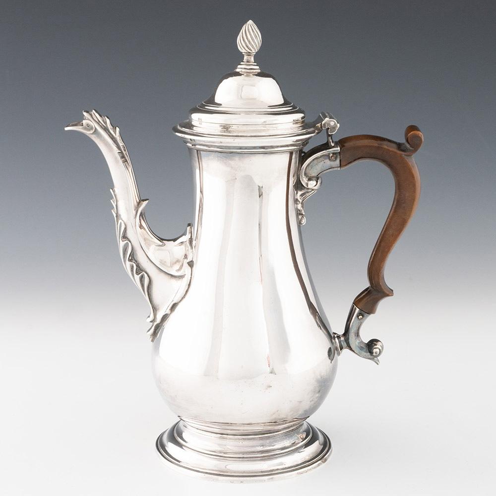 Heading : Sterling silver coffee pot with acorn finial
Date : Hallmarked in London in 1769 for Edward Aldridge II
Period : George III
Origin : London, England
Decoration : Baluster form with acnthus leaf casting to spout, scrolled wooden handle,
