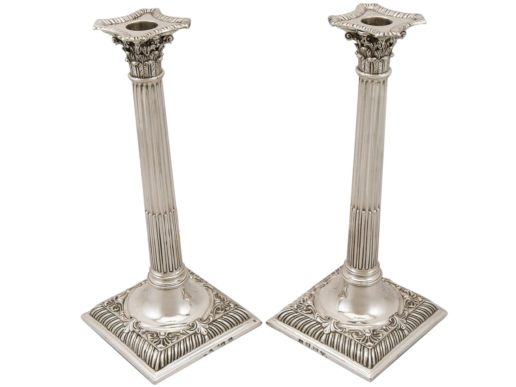 A fine and impressive pair of antique George III English sterling silver Corinthian column candlesticks, part of our ornamental Georgian silverware collection.

These fine antique George III sterling silver candlesticks have Corinthian columns to