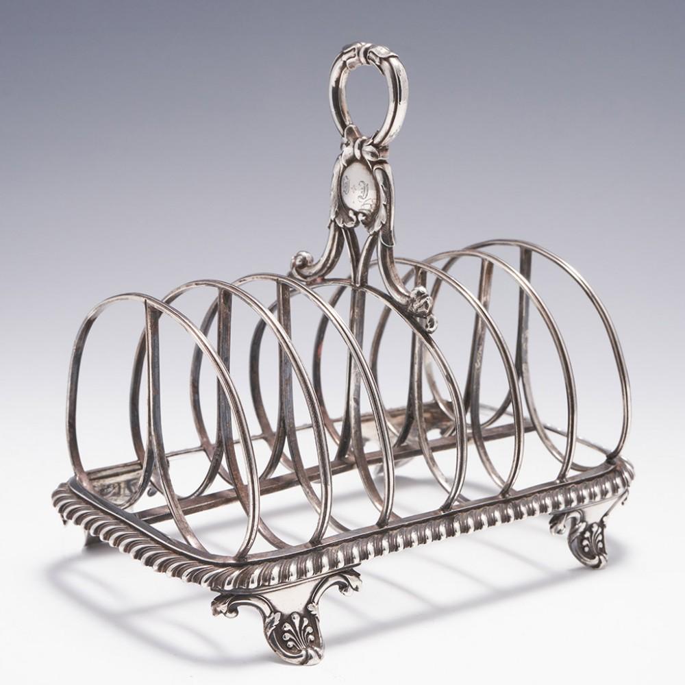 Georgian Sterling Silver Toast Rack London, 1827

Additional information:
Date : Hallmarked in London 1827 For Rebecca Emes and Edward Barnard
Period : George IV
Origin :London England
Decoration : Six reeded divisions. Pie crust frame
Size :  H