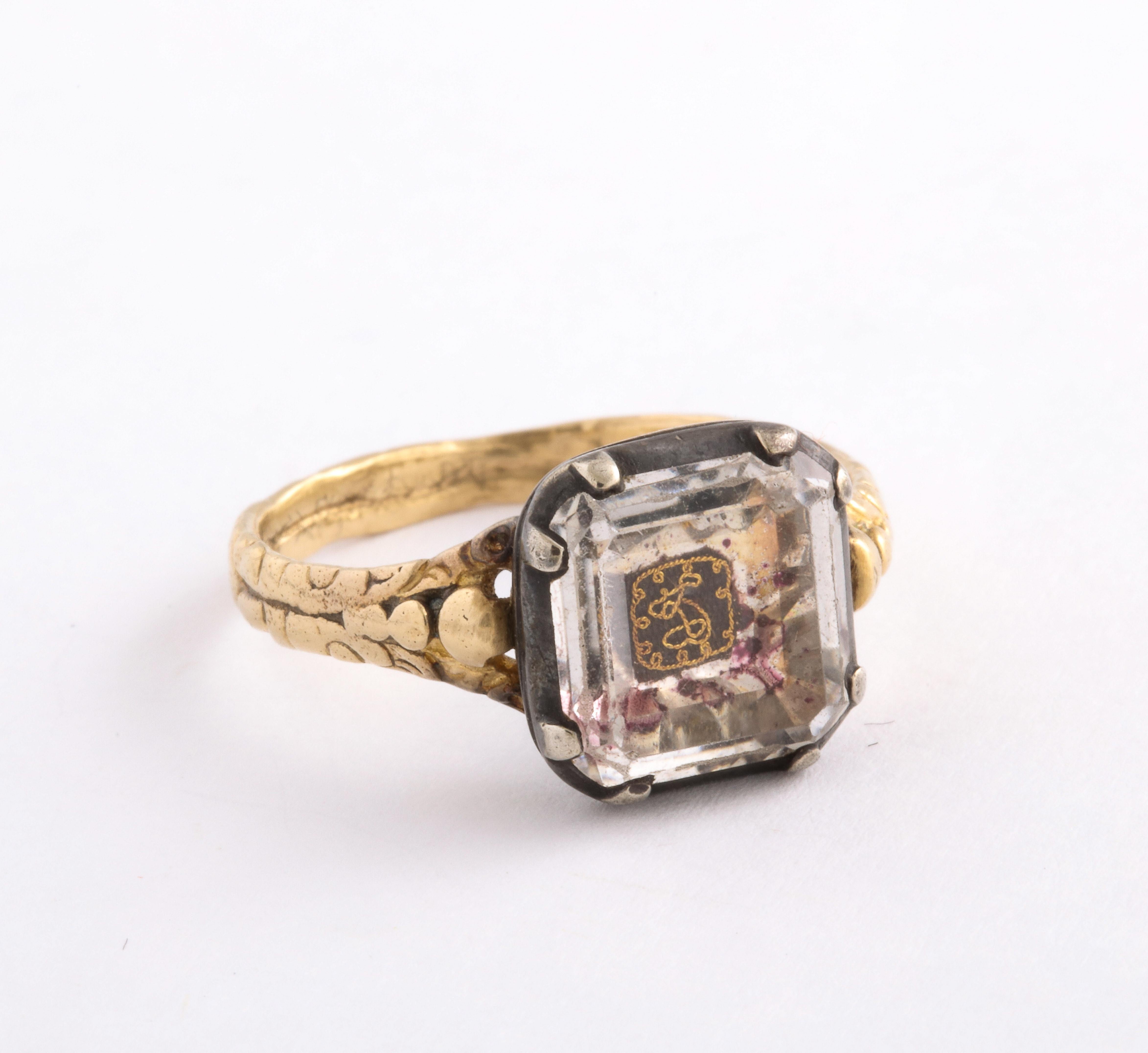 A rare, beautiful and magical Stuart Crystal Ring set in 15 Kt gold and backed in sterling silver. Before I say more please understand that none of the impurities shown in the photographs are visible to the  eye. Photography sees deeply behind the
