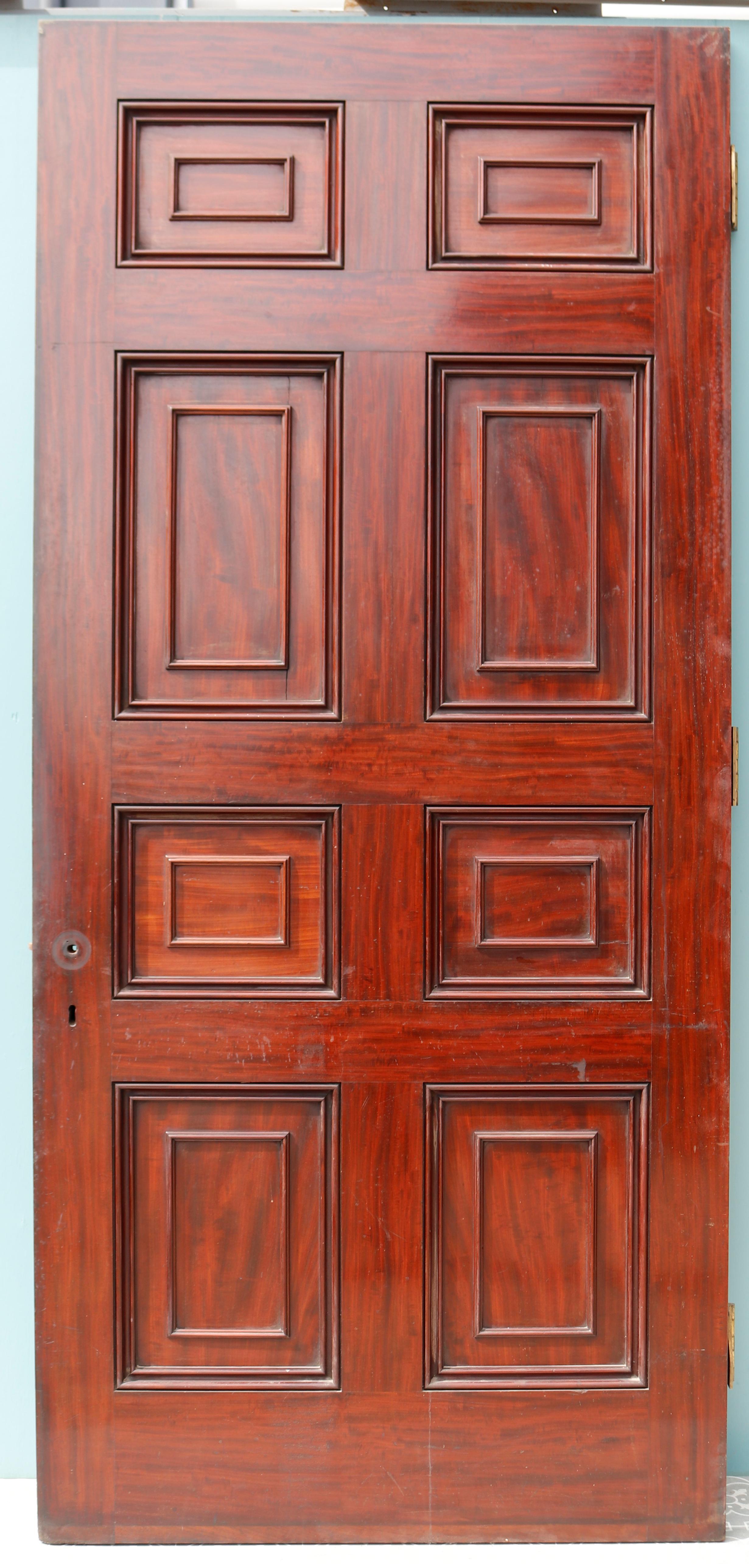 A tall antique Georgian style, eight panel door veneered with mahogany. We recently found this in our stores, the last of ten salvaged from a mansion in Shropshire.