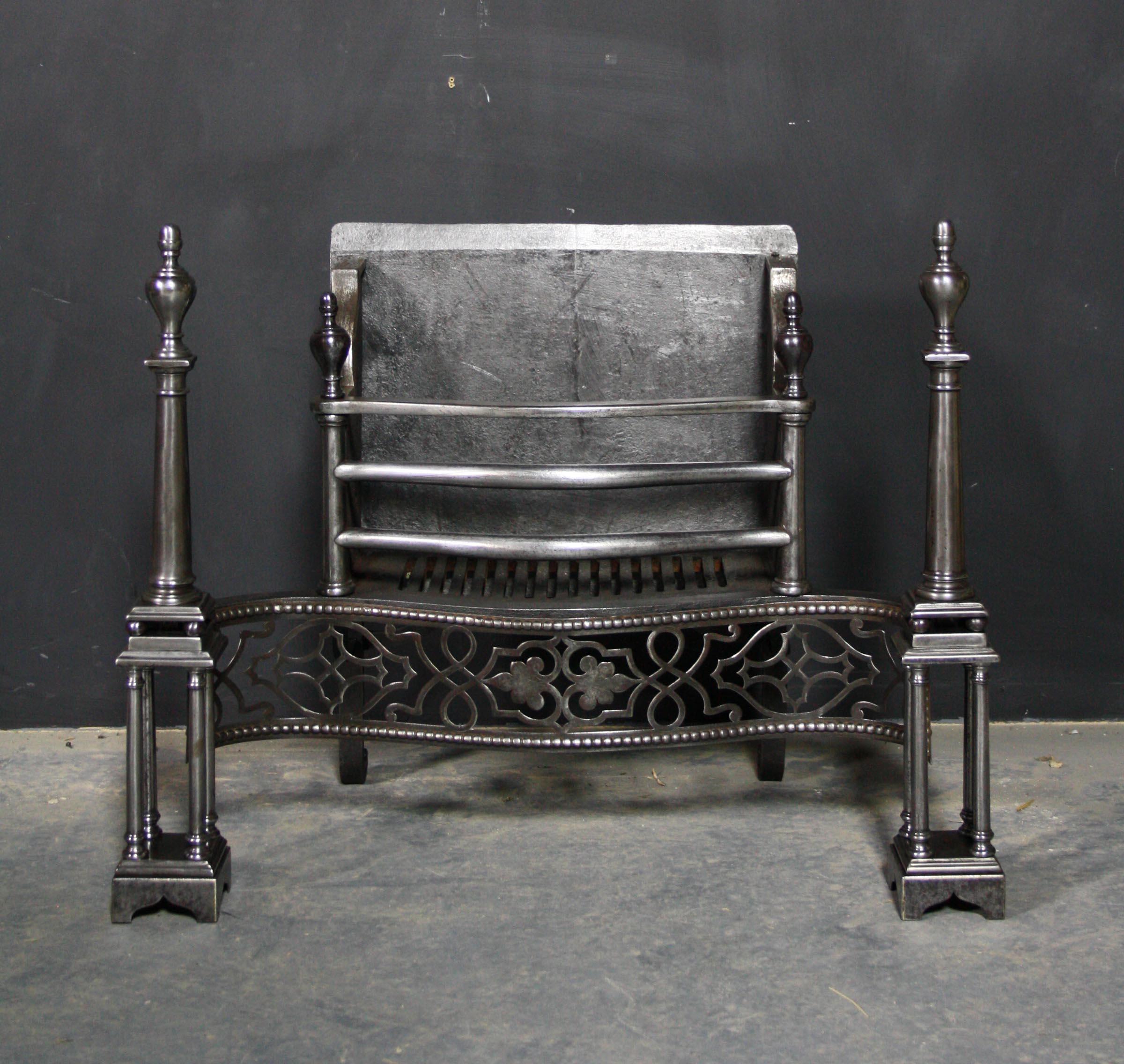 A Late 18th - early 19th century fire grate in the Georgian style. Constructed from polished steel, with a pierced fret and quadruple columns.