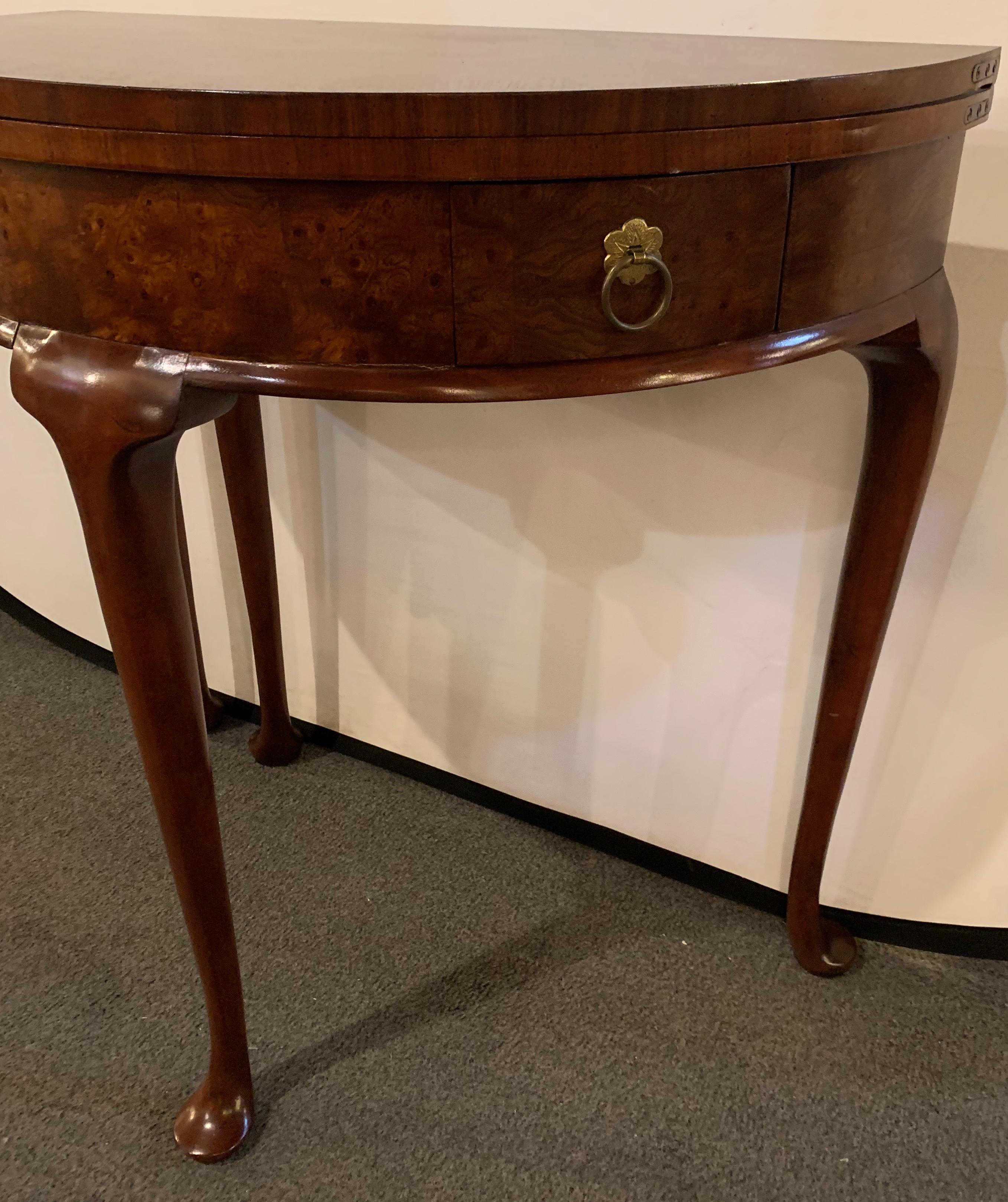 Georgian style baker mahogany demilune flip top end or card table. This stunning side table by this fine furniture manufacturer is simply breathtaking. The deep bow front having two drawers with fine pulls. The flip top makes this table multi