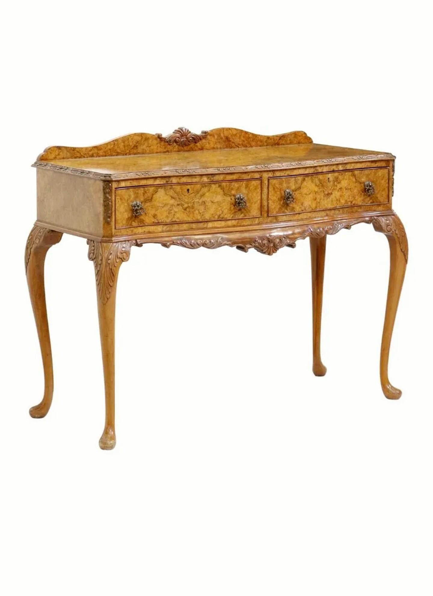 A stunning Georgian Revival burlwood silver chest / buffet server.

Refined, elegant, sophisticated English styling, exquisitely hand-crafted in the mid-20th century, having a serpentine-front highly figured burled walnut top with hand-carved