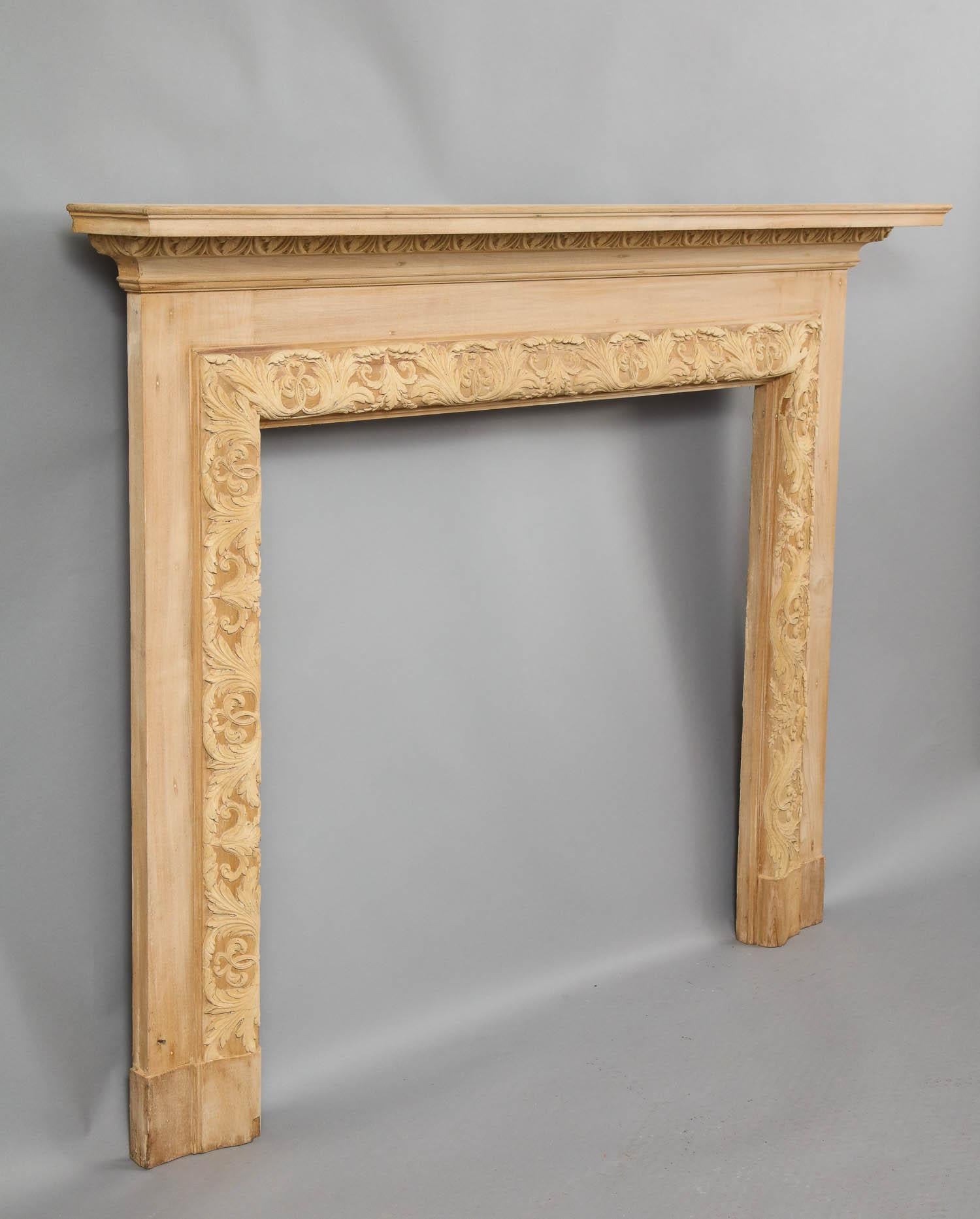 Very fine early 20th century Georgian style mantel, having floral carved egg and dart molding over bolection molded opening having applied composition decoration with foliate sprays and scrolls, now stripped. Removed from a prominent Westchester