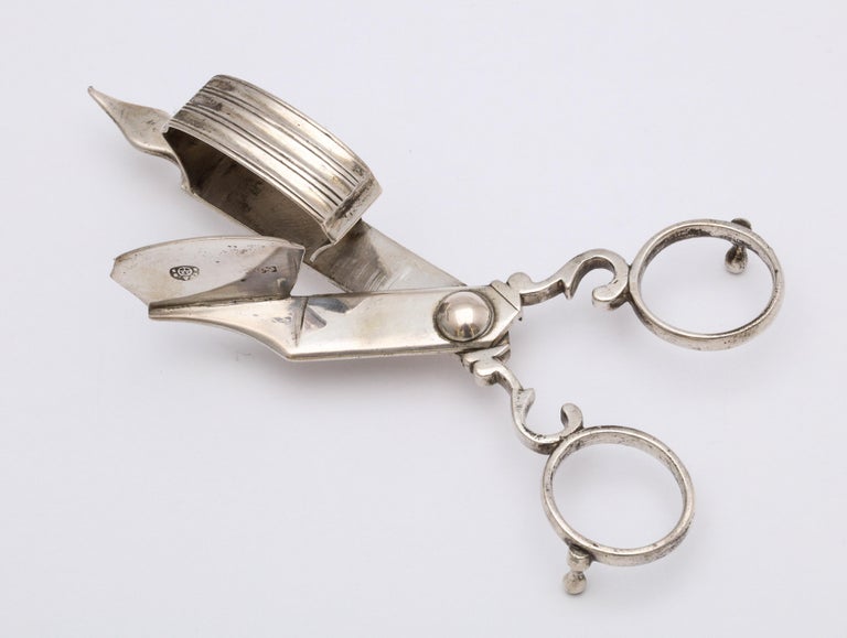 Georgian-style, Continental silver (.800) candlewick snuffer or cutter, Austria, year -hallmarked for 1855. Measures 5 inches long x 1 3/4 inches wide (at widest point) x 1 1/4 inches high at highest point. When fully open, the snuffer measures 2