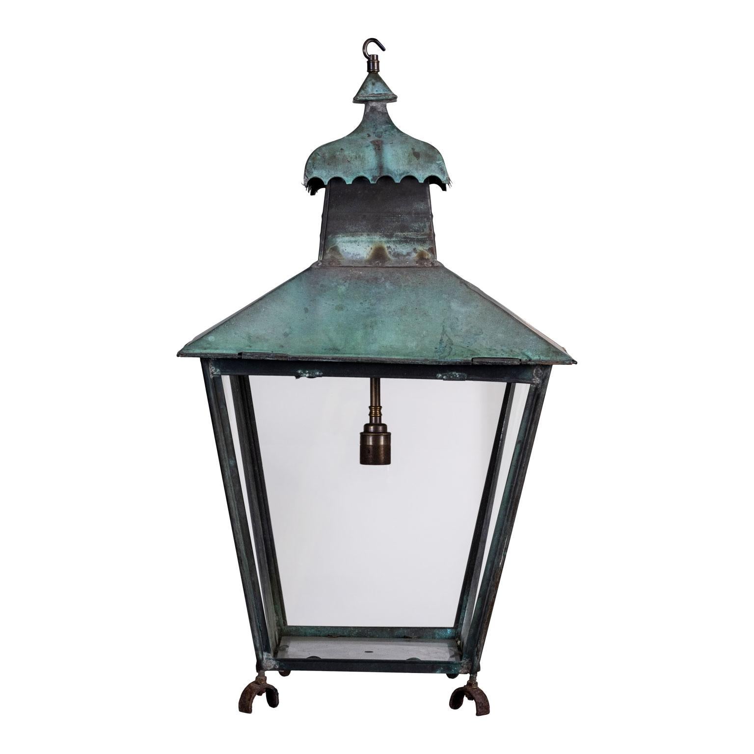 Georgian style copper lantern paneled in glass, circa 1920. Includes chain and a canopy (listed height does not include chain). Lantern can either be wired for electricity or fitted for use with gas for an extra cost.