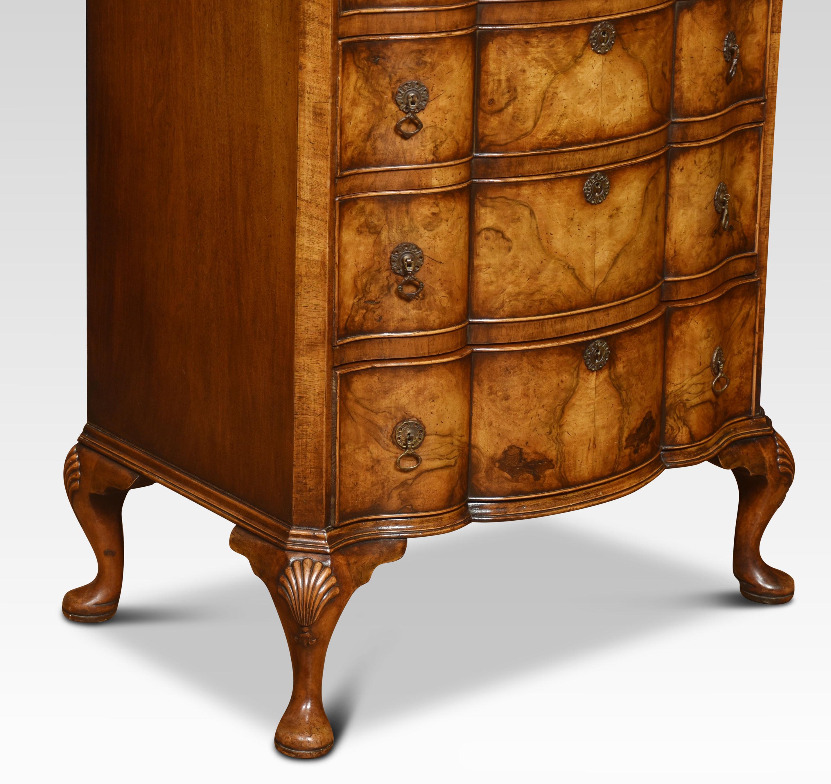 Georgian-style figured walnut serpentine fronted chest of drawers, the moulded top above six long graduated drawers, all having solid oak liners and brass tooled handles, All raised up on cabriole legs.
Dimensions
Height 49 inches
Width 29