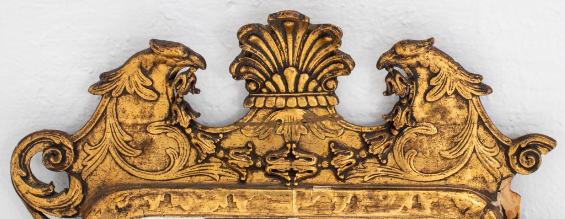 Georgian Chinese Chippendale style giltwood mirror, the crest flanked by two Fenghuang ho ho birds, overall with scrolling details.
