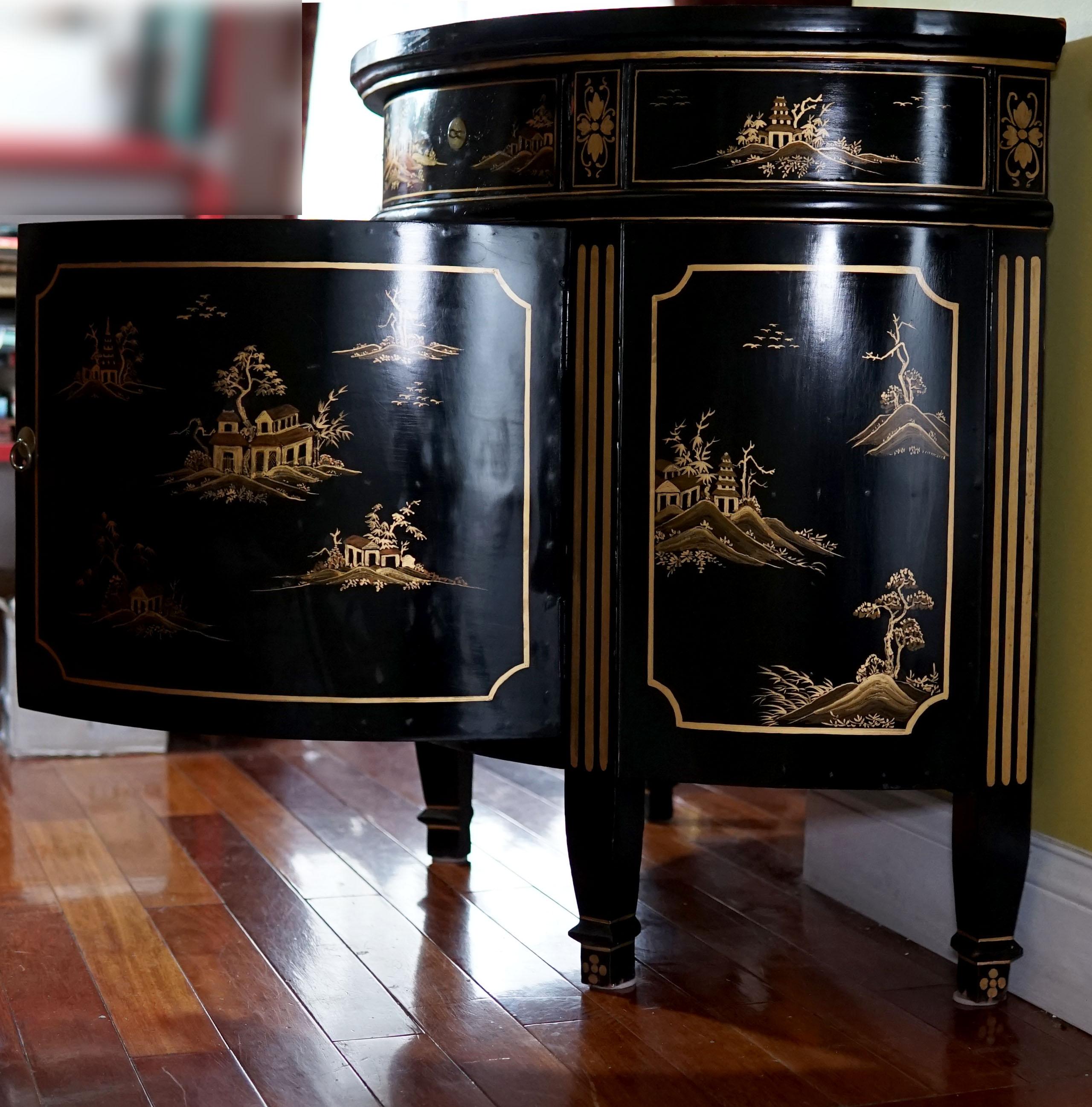 The combination of gilt and ebonized wood create drama in this Georgian style demilune cabinet. This is a beautiful console cabinet with a dramatic feel for maximum elegance of design in the Georgian style, gilt and ebonized, japanned demilune