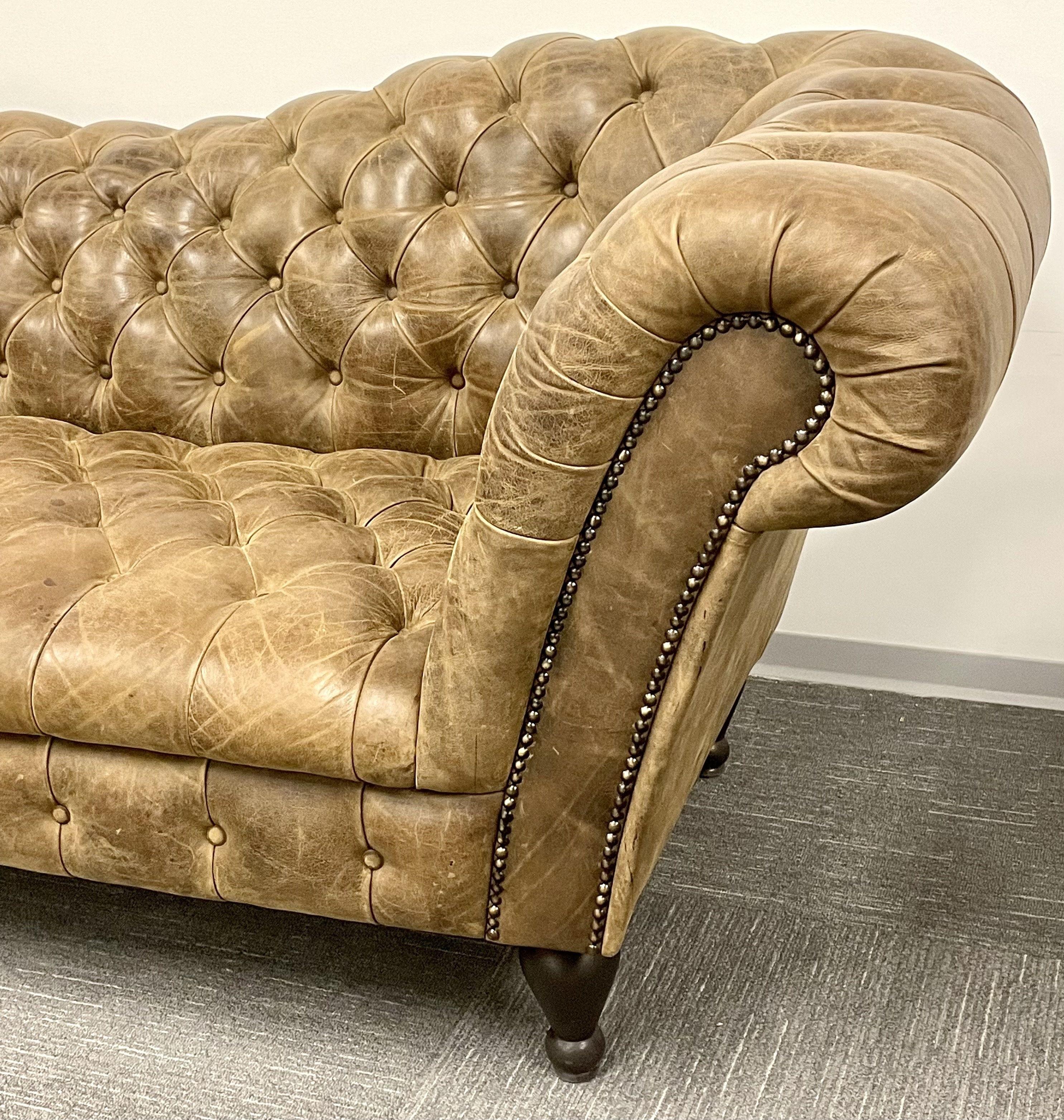 A vintage sofa in the Georgian style having rolled arms and tufted back and sides. This finely shaped sofa has a C drop in the center flowing onto the sides and arms. The whole standing on legs. If you desire a different style and look rather than