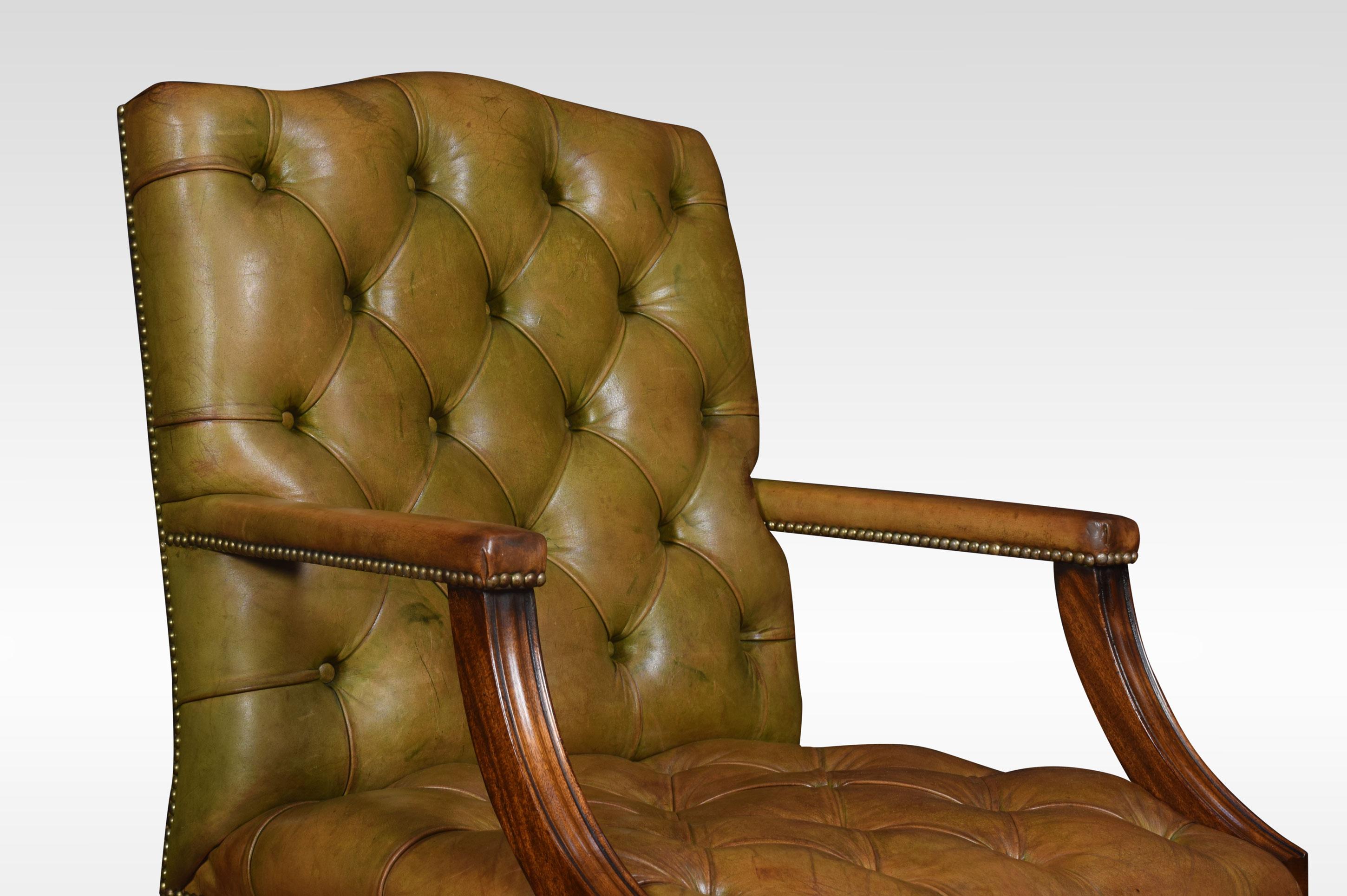 Georgian style leather Gainsborough library chair, having deep buttoned green leather back and seat with brass studded edges. The solid mahogany framed standing on square legs, united by stretcher.
Dimensions:
Height 39.5 inches, height to seat 18