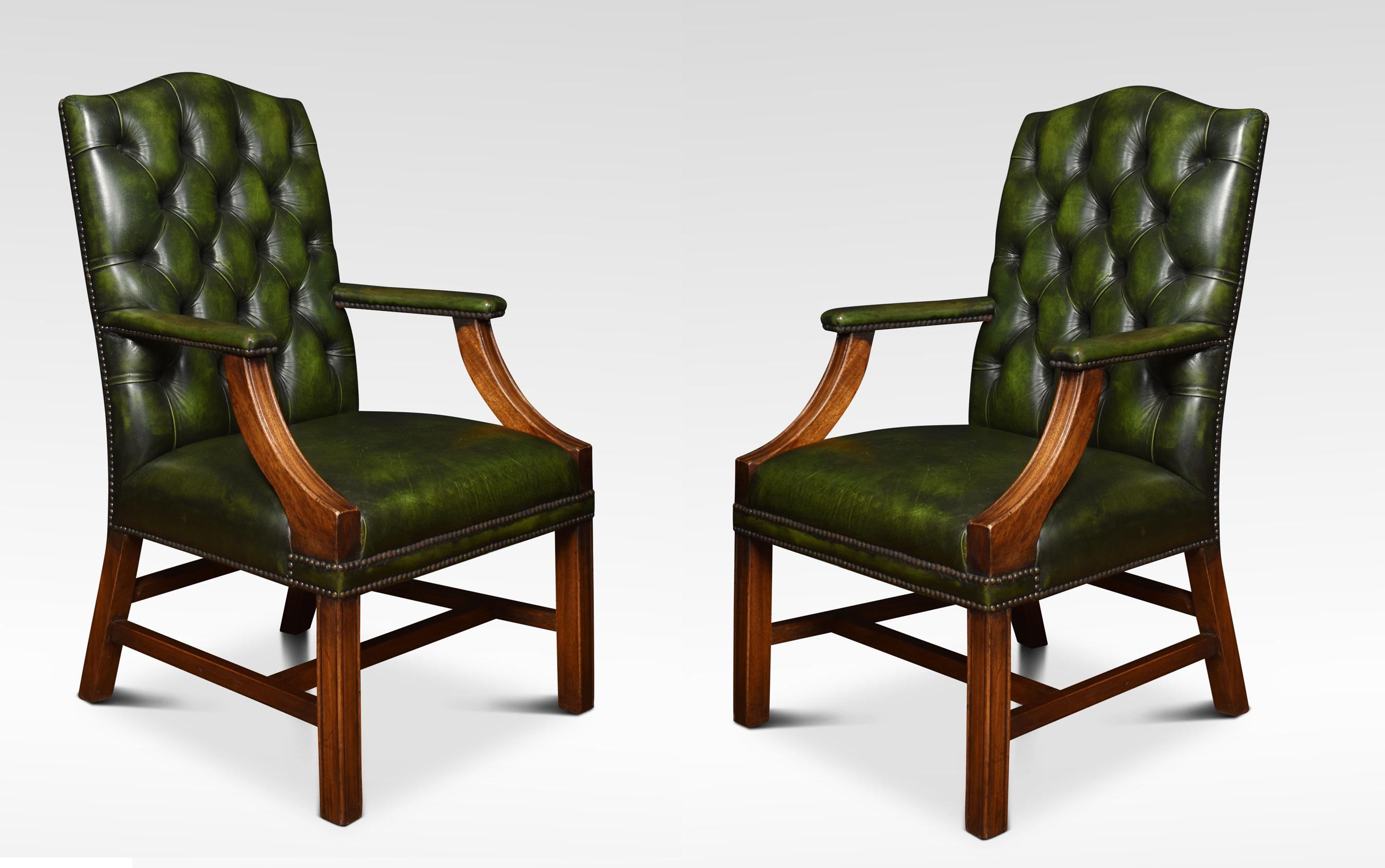 Pair Georgian style leather Gainsborough library chairs, having deep buttoned green leather backs and seats with brass studded edges. The solid mahogany framed standing on square legs, united by stretcher.
Dimensions
Height 39.5 inches height to