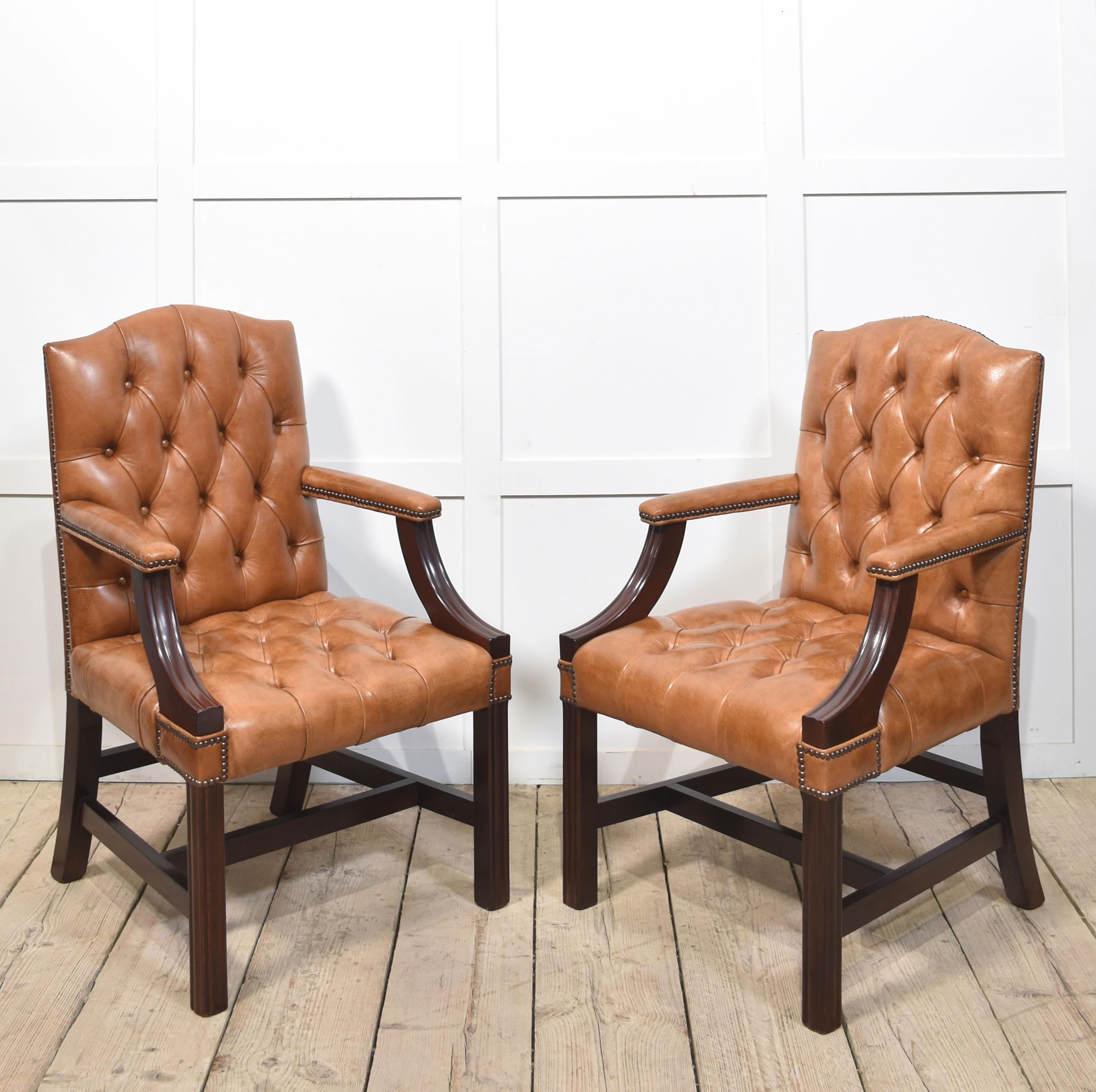 Pair Georgian style Leather Gainsborough library chairs, having deep buttoned brown leather backs and seats with brass-studded edges. The solid mahogany framed standing on square legs, united by stretchers.
Dimensions
Height 39.5 Inches Height to