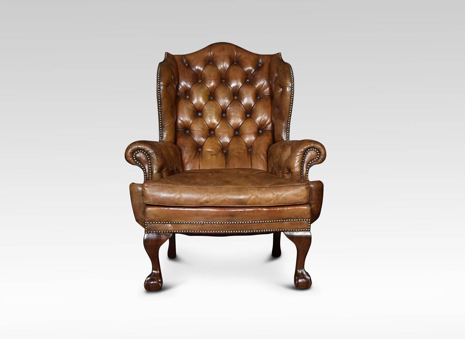 A Georgian style armchair, the winged deep buttoned back and seat upholstered in brown leather, flaked by out swept arms. All raised up on cabriole front sports terminating in claw and ball feet
Dimensions:
Height 42.5 inches, height to seat 18