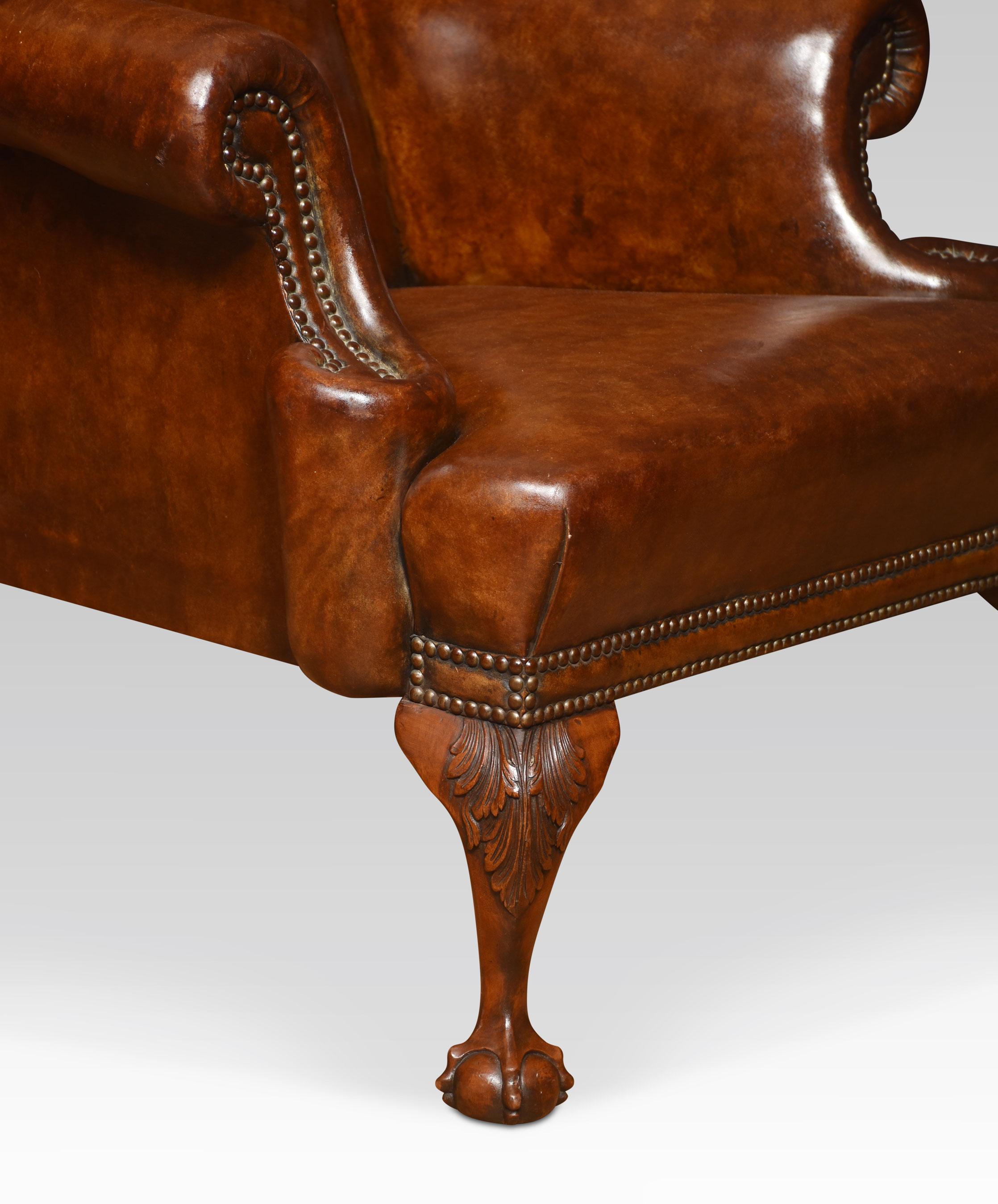 A Georgian-style armchair, the winged back and seat upholstered in brown leather, flanked by out swept arms. All raised up on cabriole front sports terminating in claw and ball feet
Dimensions
Height 43.5 inches height to seat 18 inches
Width 32