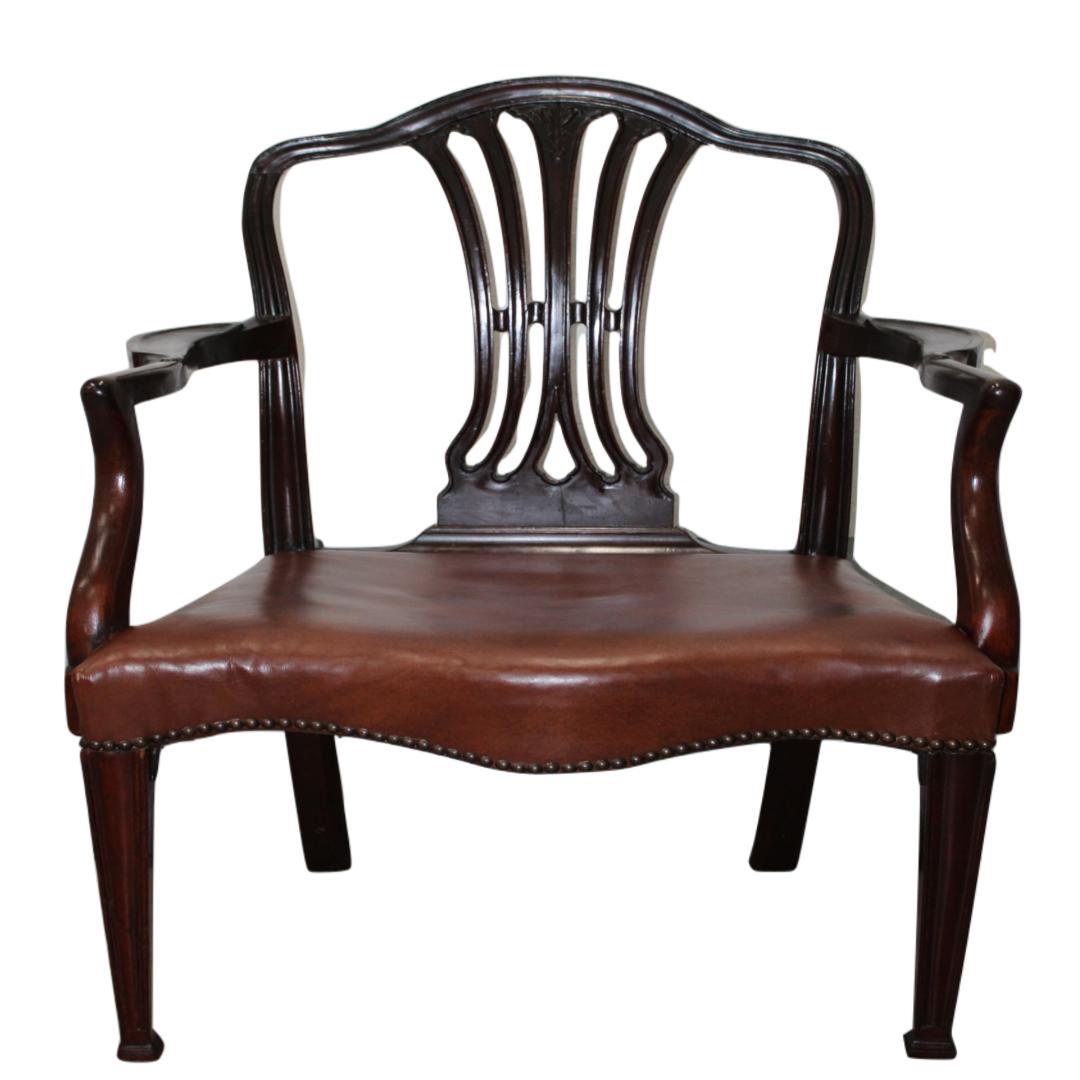 C. early 20th century

Georgian style mahogany armchair w/ leather upholstery & brass edging.