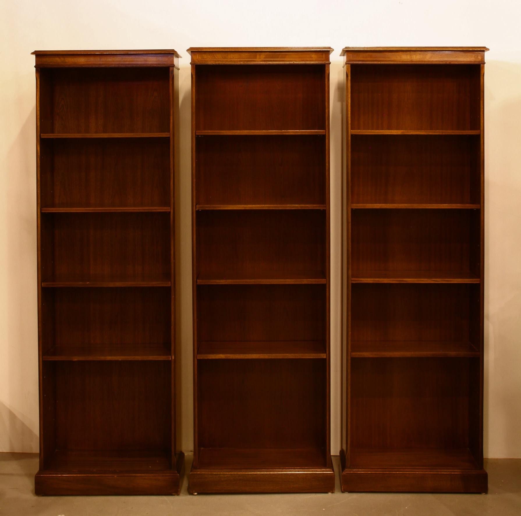 A lovely group of English bookcases with finely styled details. Crafted in mahogany, with string inlay on the shelf front edge.
Small in scale with lots of storage for books and collectables. Four adjustable shelves make these very flexible and