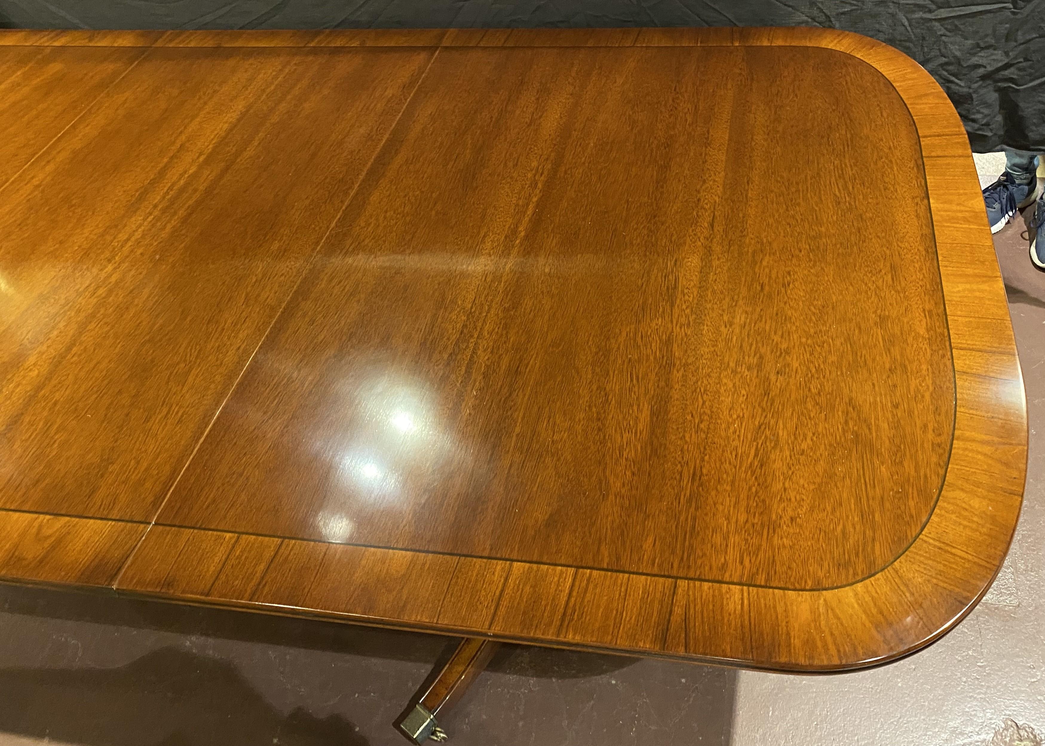 Hand-Carved Georgian Style Mahogany Double Pedestal Banded Dining Table with Two Leaves